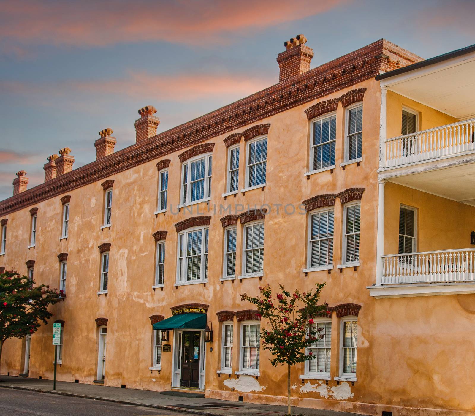 Old Stucco Building at Dusk by dbvirago