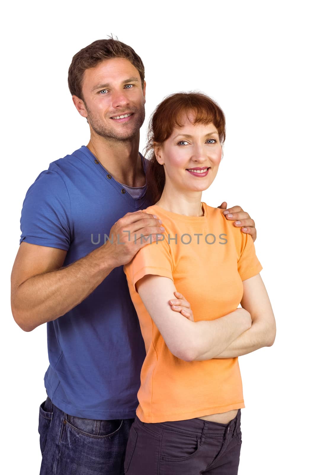 Happy couple looking at camera on white background