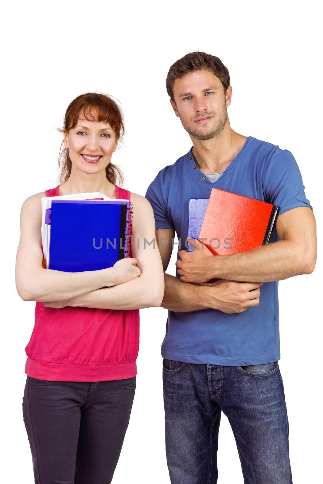 Two students both with notepads looking at camera