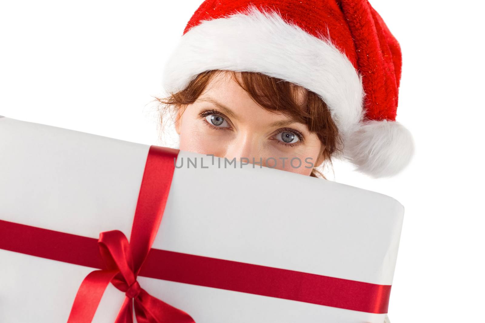 Woman holding a christmas present by Wavebreakmedia