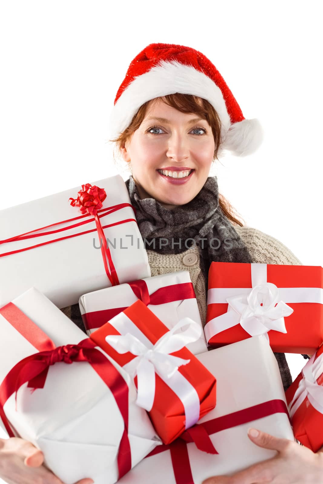 Woman holding lots of presents on white background