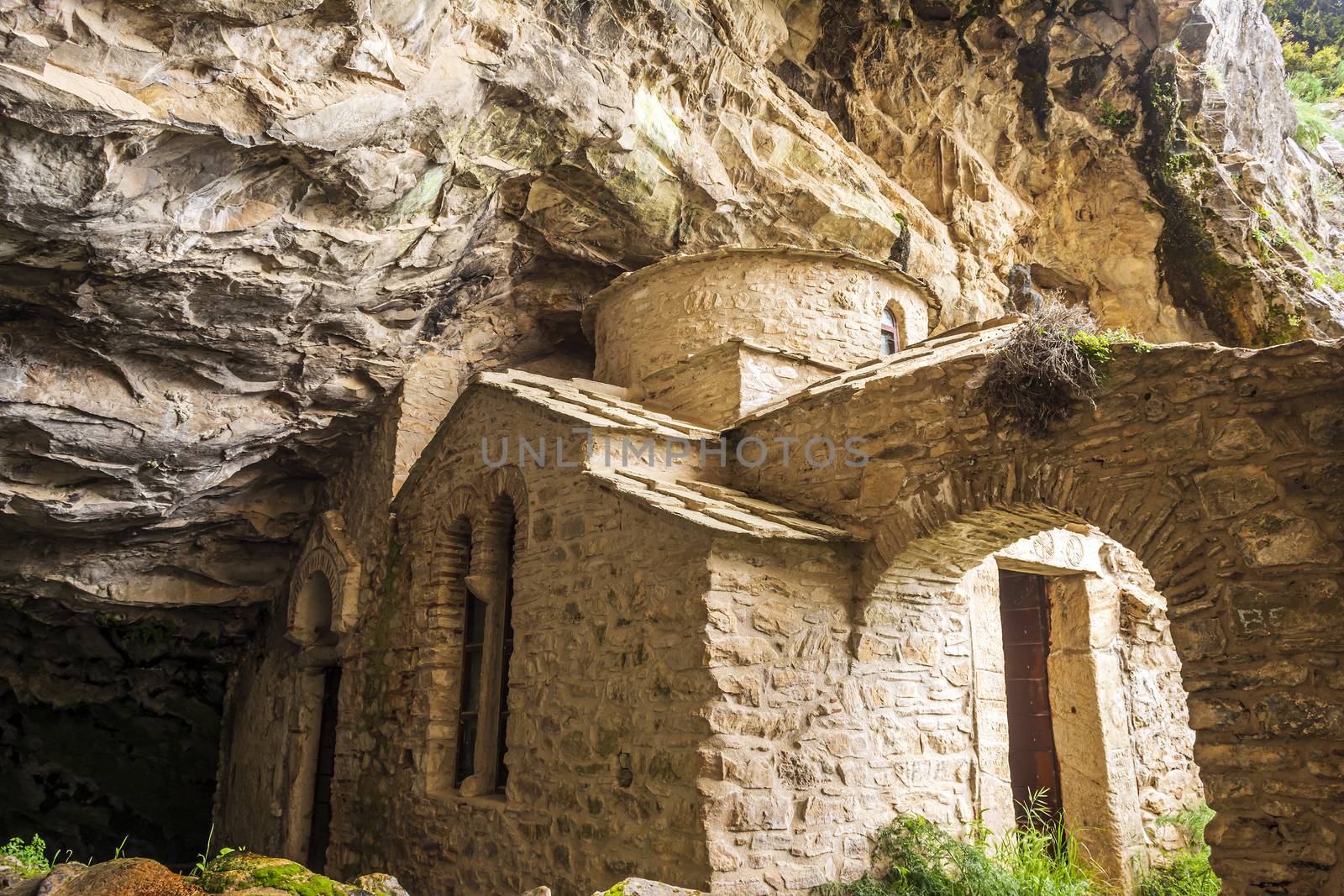 Orthodox monastery enclosed by Davelis cave in Penteli, a mountain to the north of Athens, Greece.