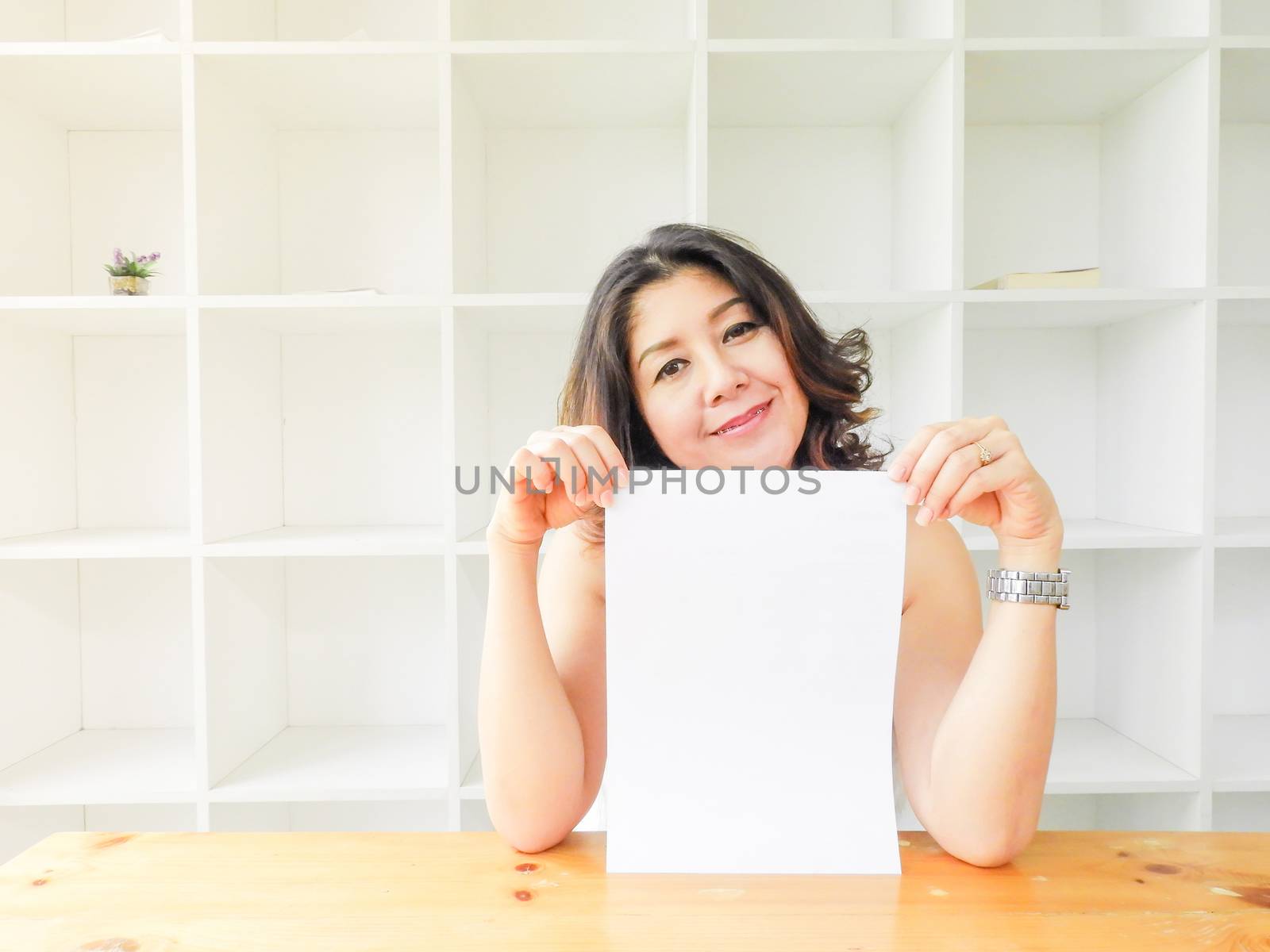 Beautiful woman smiling happy against white background.
