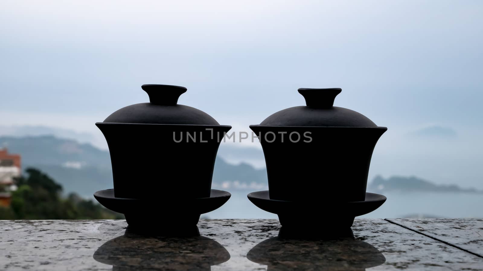 The classic Taiwanese tea cup on top of wall with sea view at Jiufen old street in Taiwan.