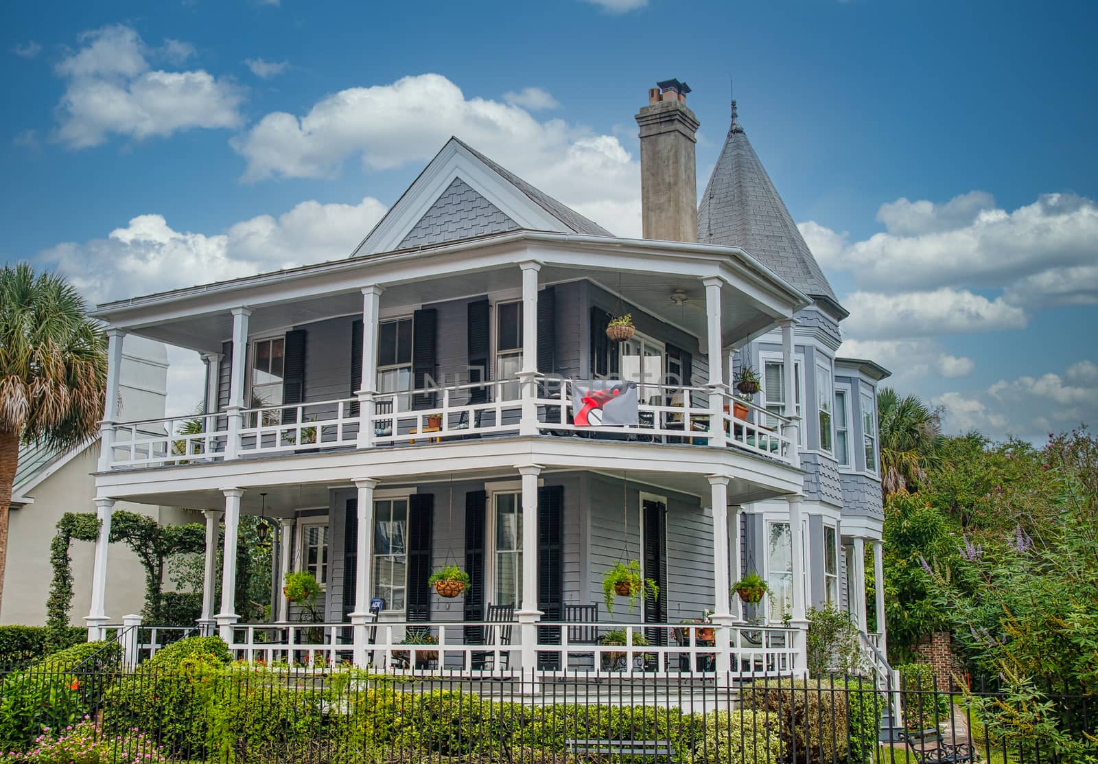 A grey traditional southern home in Charleston, South Carolina