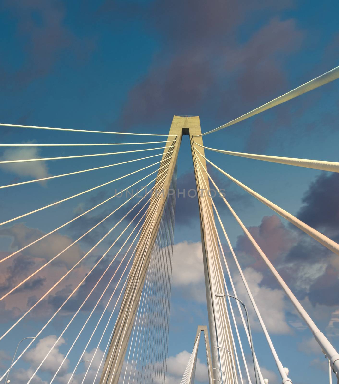 White Suspension Bridge Into Blue Skies by dbvirago
