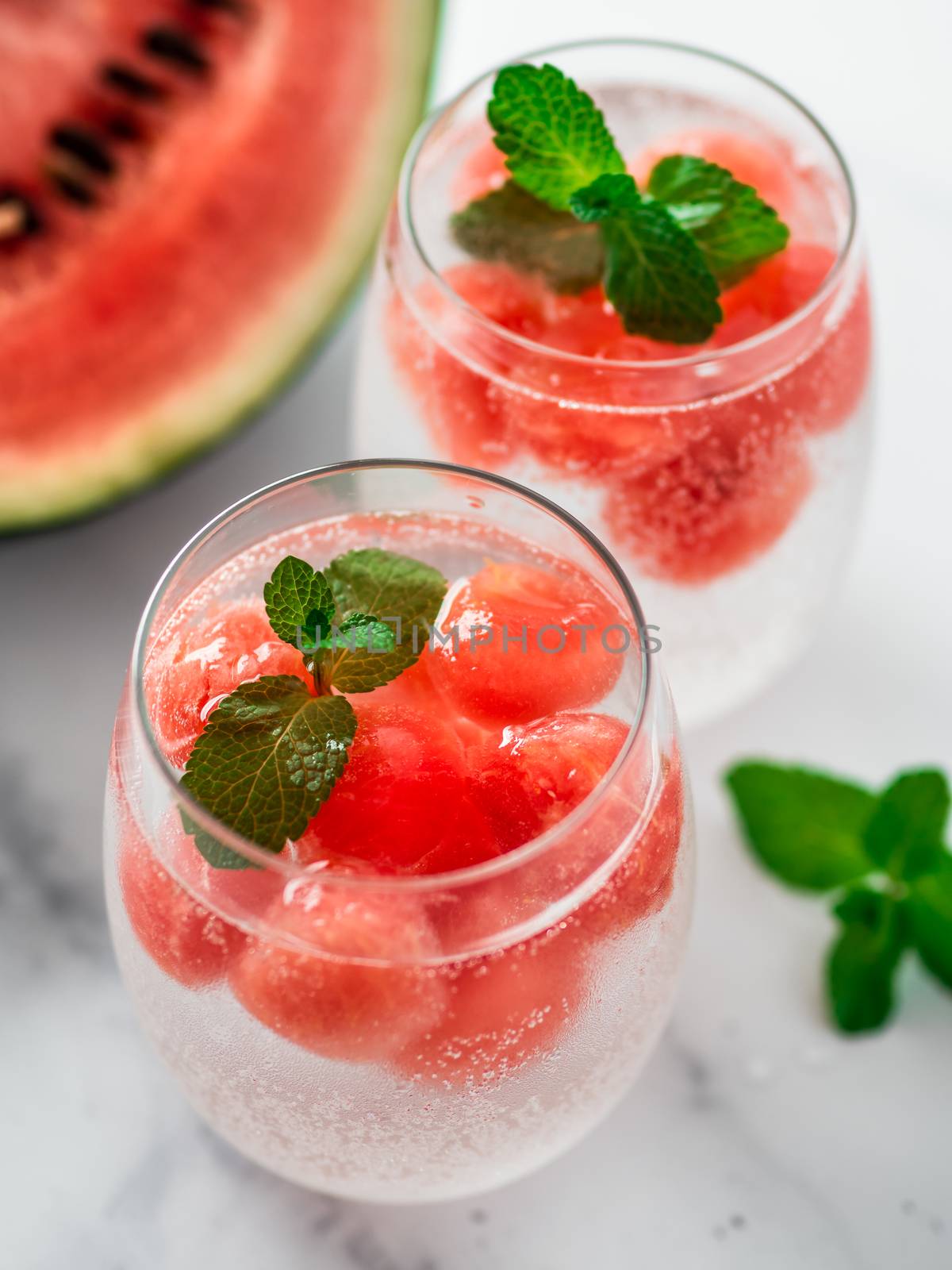 Watermelon ice with sparkling water in glasses by fascinadora