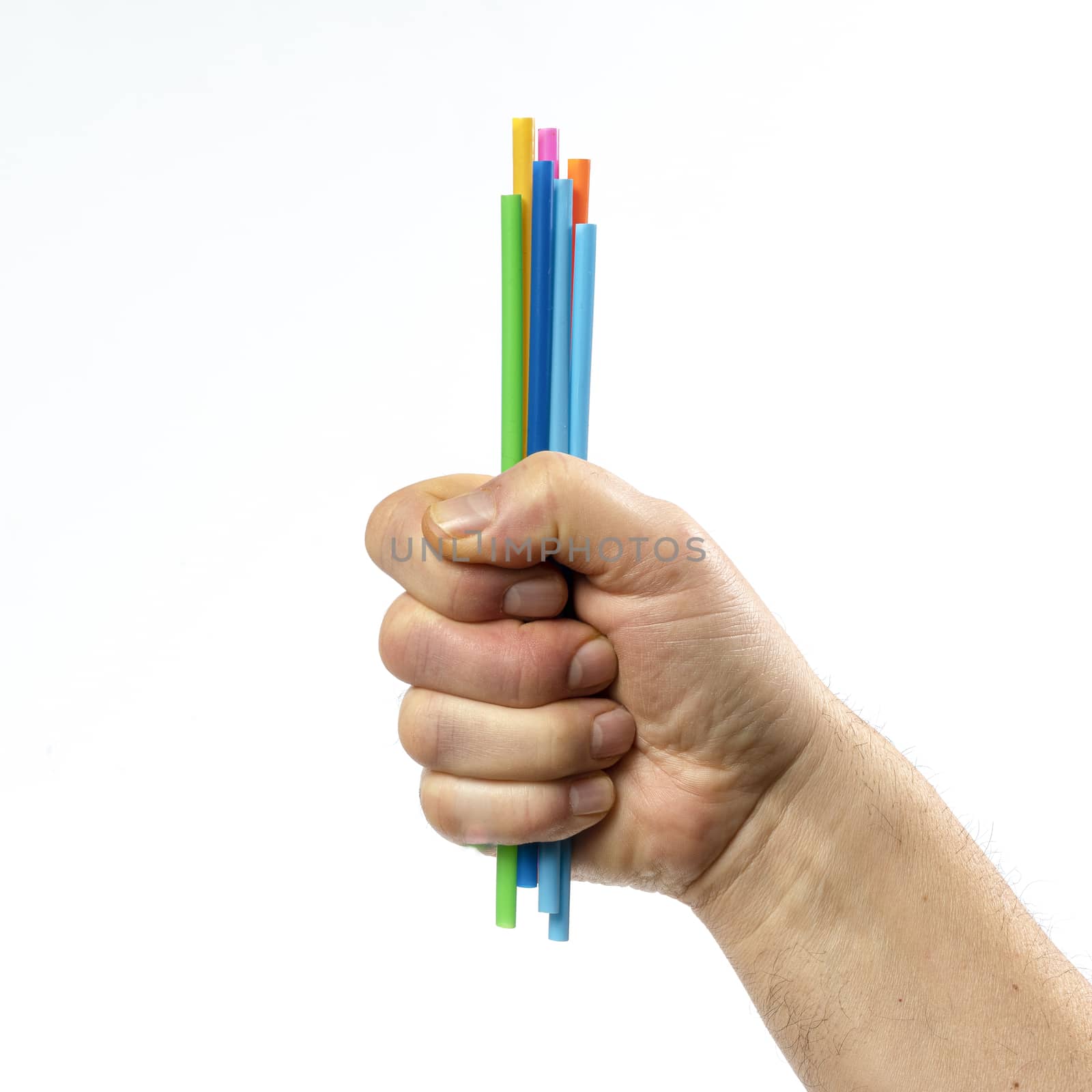 some colored plastic straws in hand