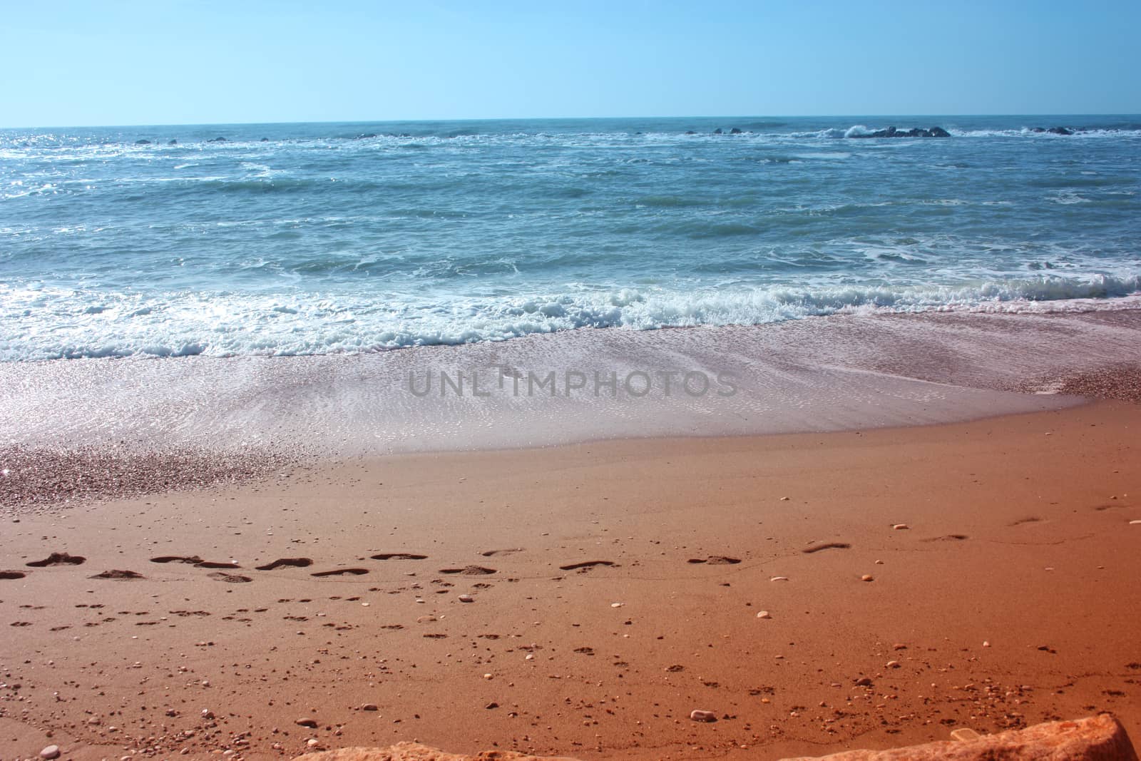 A winter beach with rough seas with cold and dull colors in the Versilian Riviera in italy