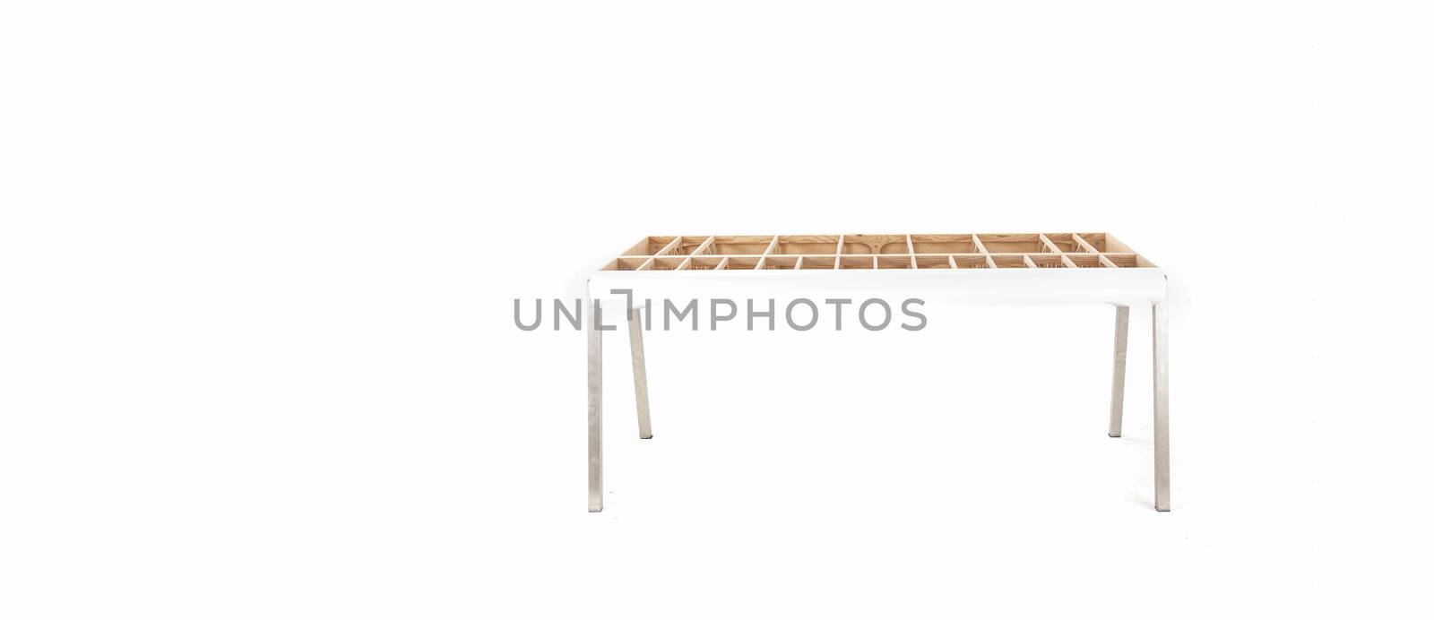 hand made designer table showing framework without table top with white copy space