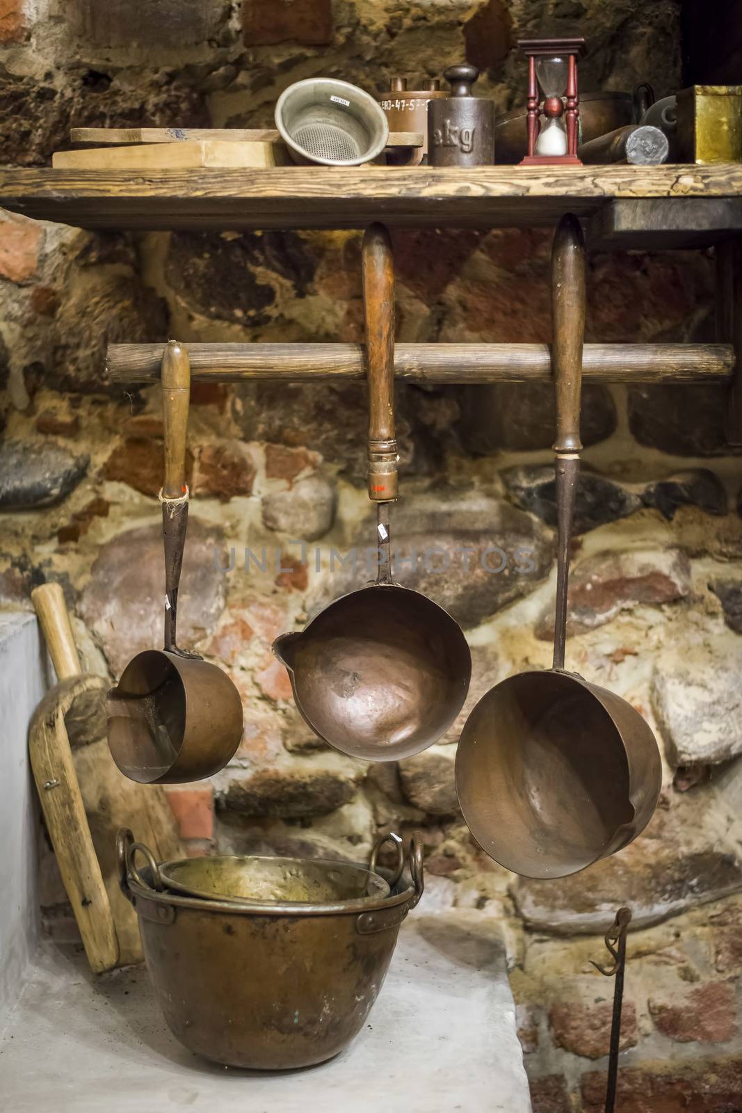 Copper ladles in the kitchen, pharmacy museum, Poland