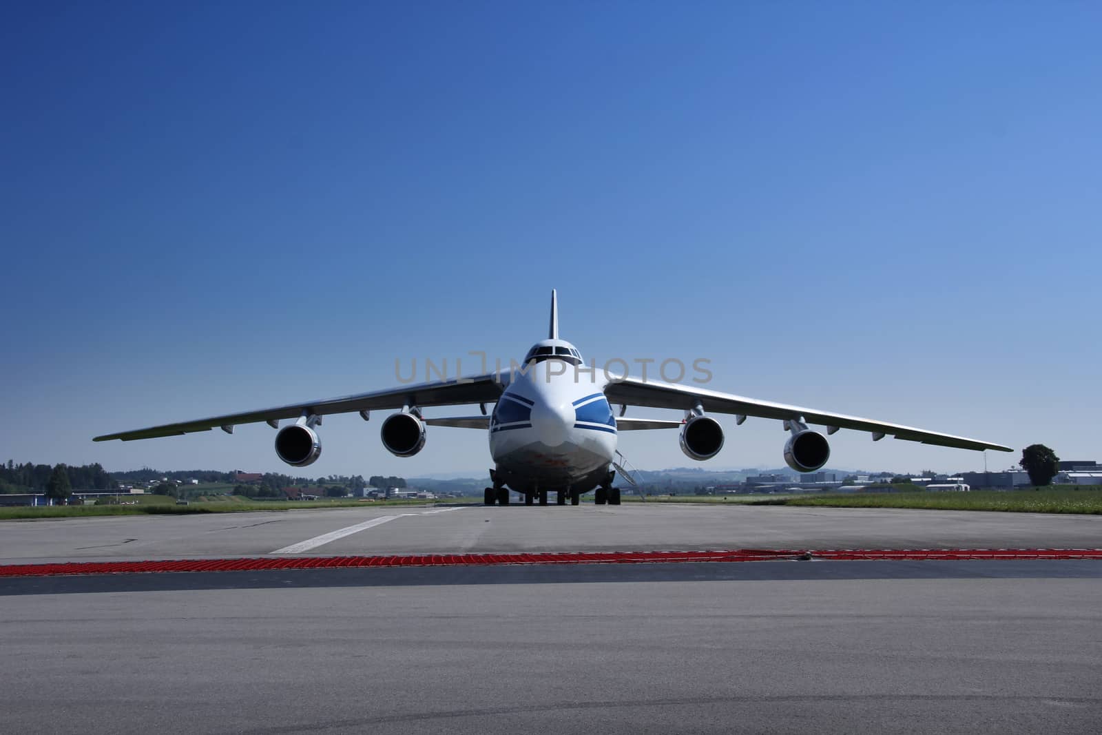 Antonow An 124 landing and off loading and taking off in Switzerland, with blue sky