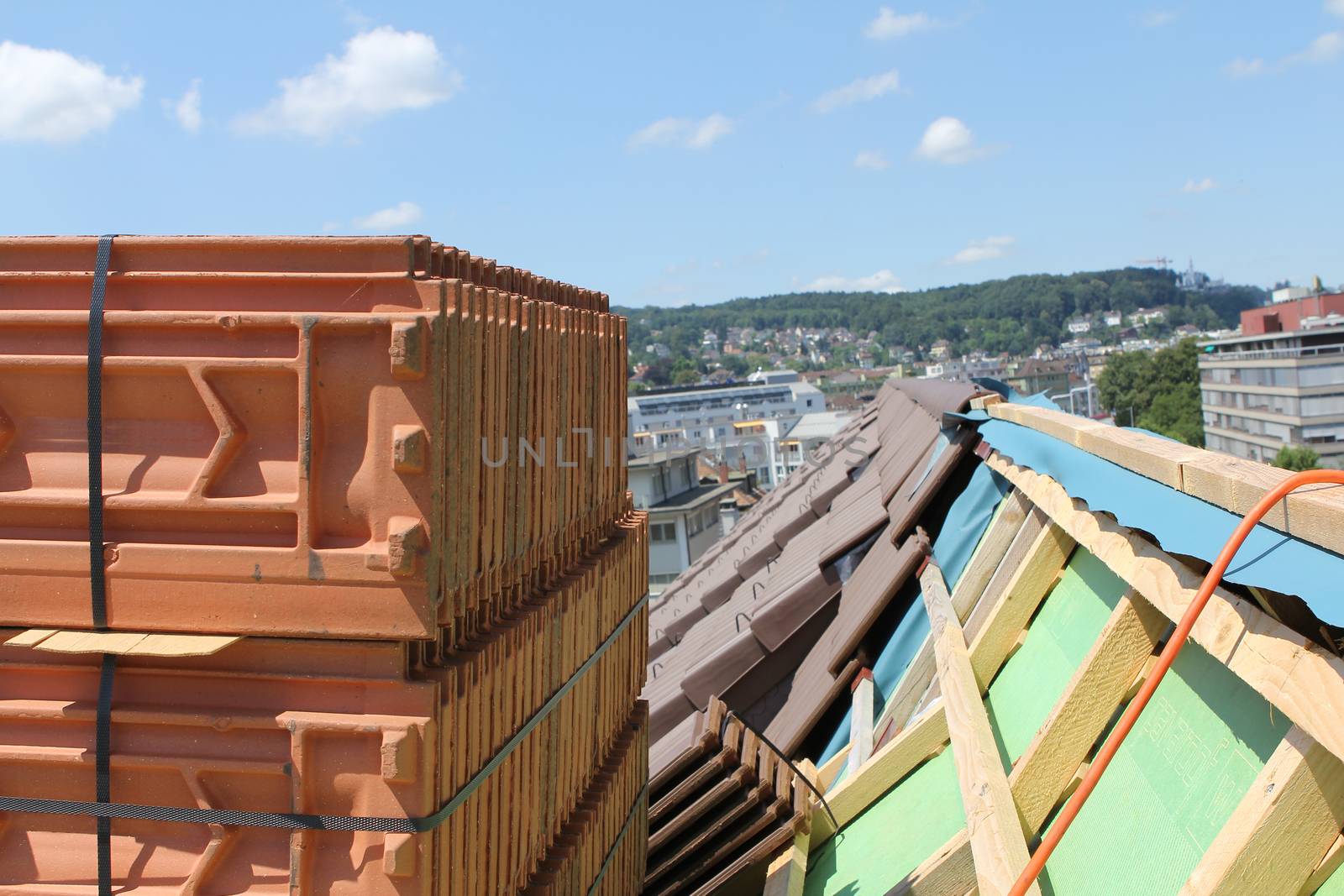 roofing work on a house on Lucerne Switzerland. With blue sky