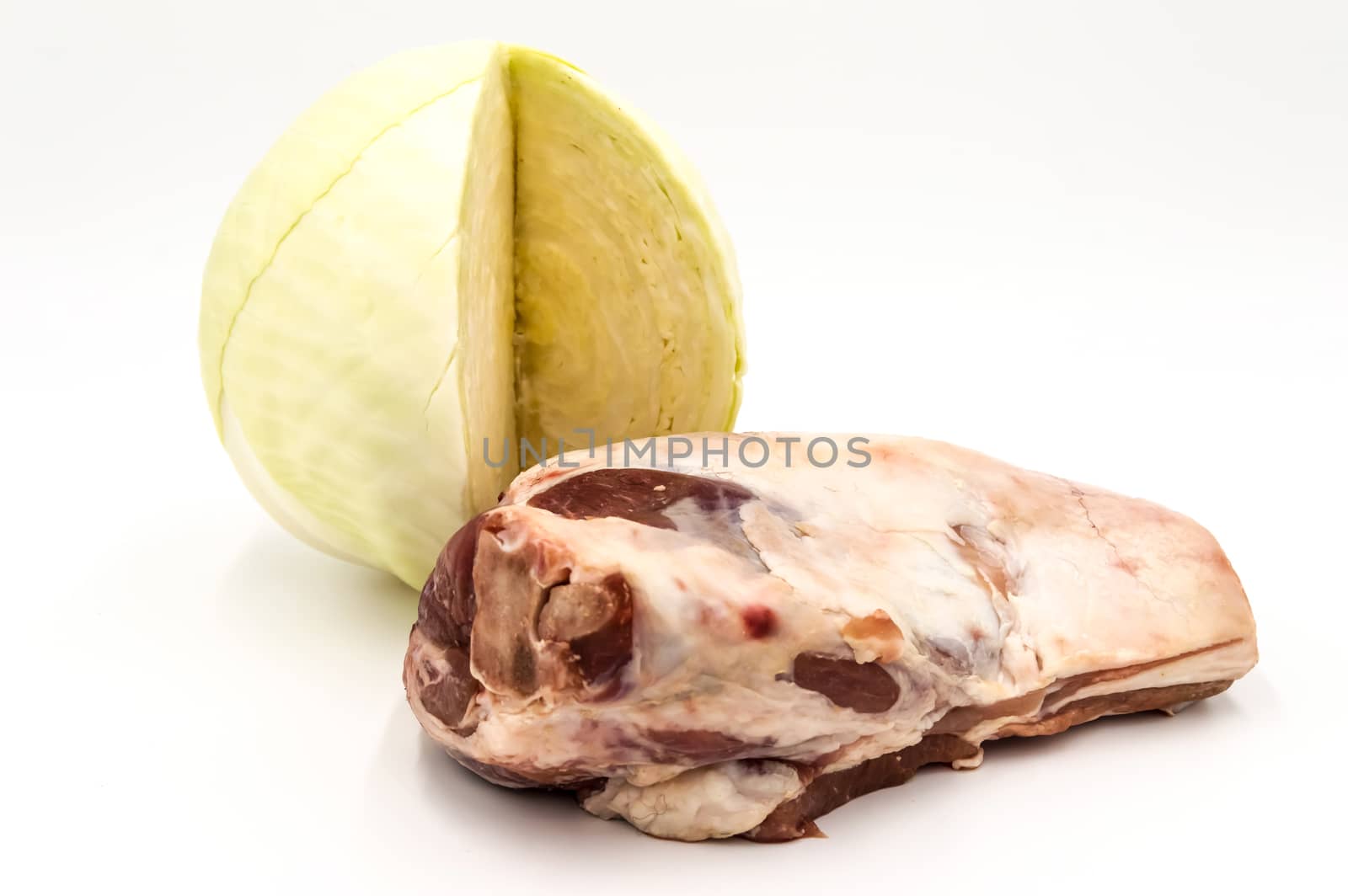 Lamb shoulder and white cabbage on a white background