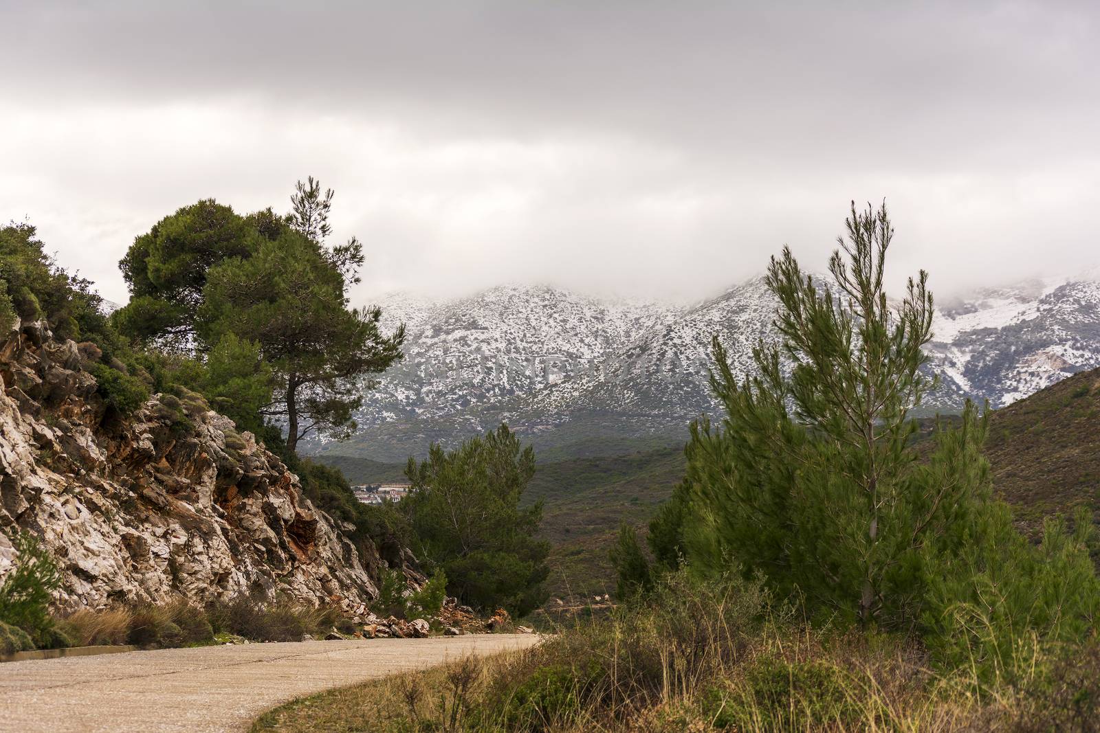 Penteli mountain with peak covered in snow. Attica. Greece.