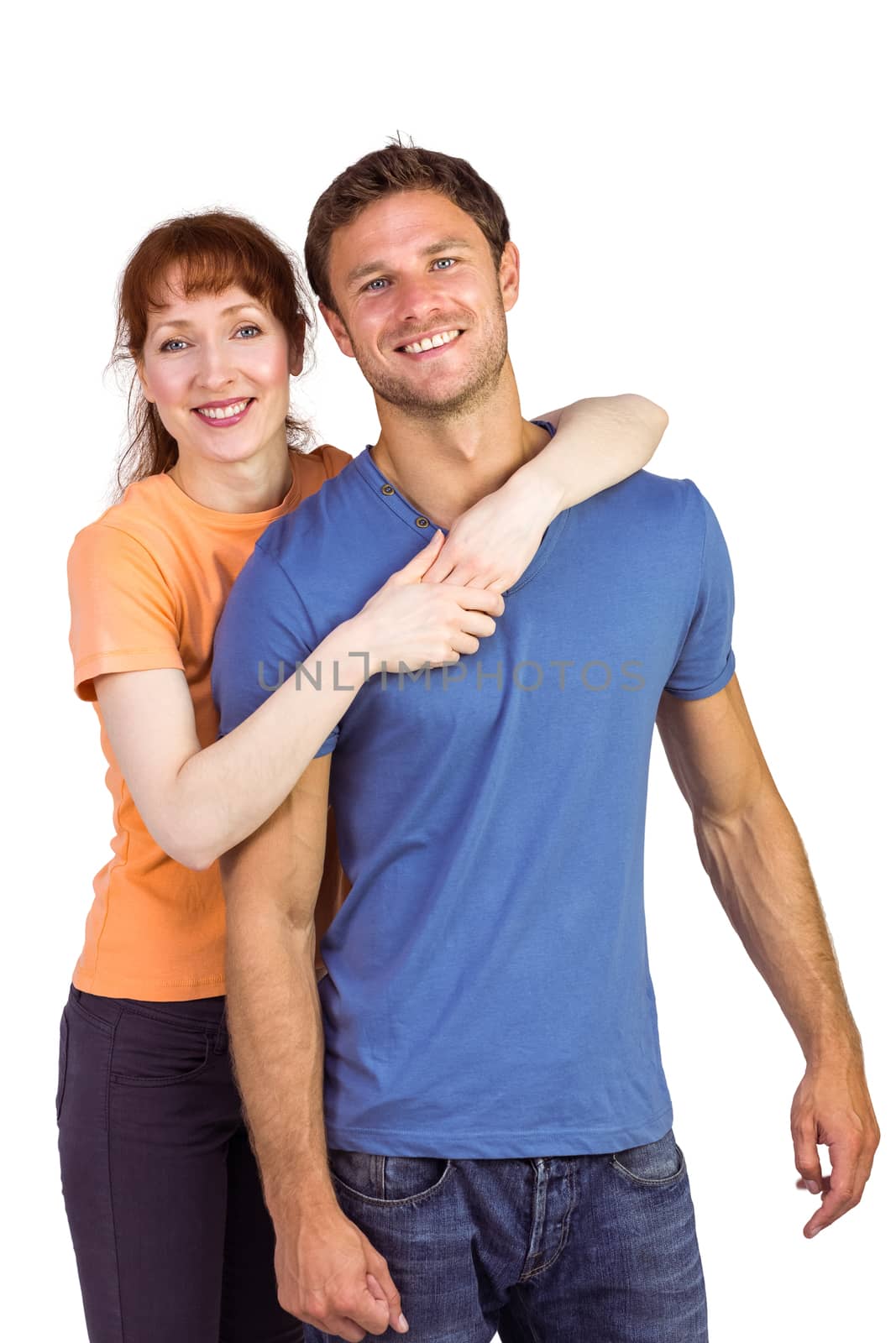 Happy couple looking at camera on white background