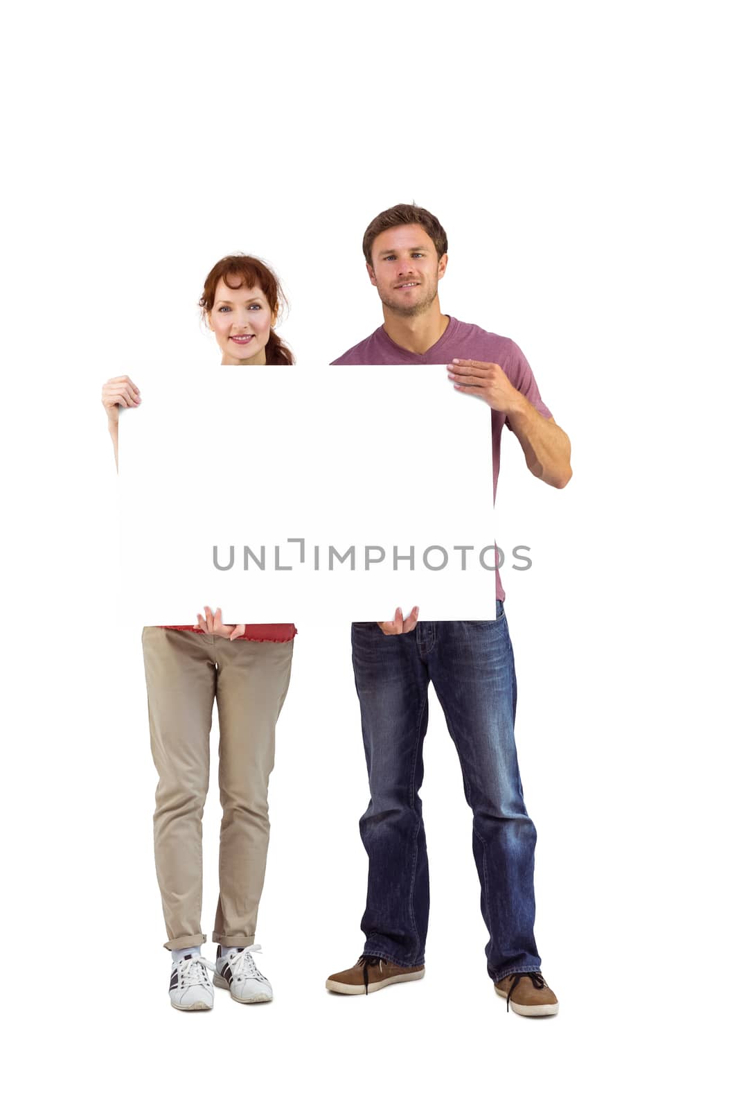 Couple holding a white sign on white background