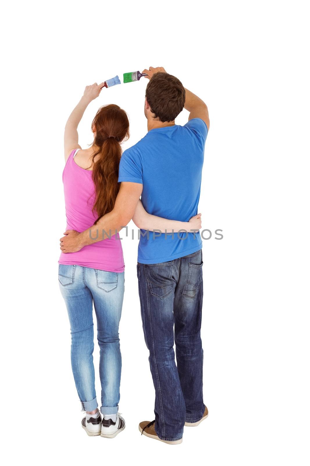 Couple both about to paint on white background