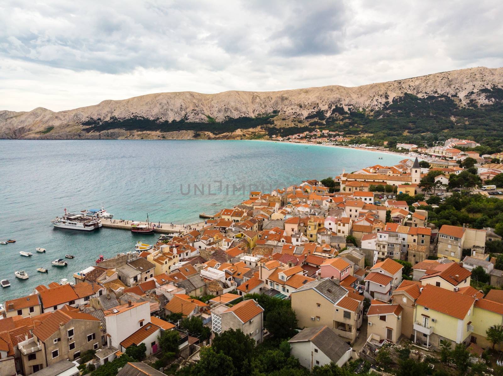 Aerial panoramic view of Baska town, popular touristic destination on island Krk, Croatia, Europe.