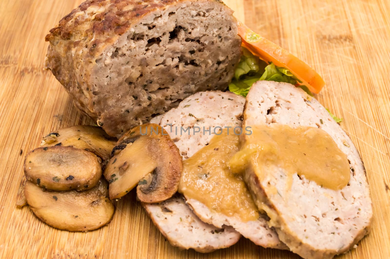 Meatloaf cut into slices with mushrooms by Philou1000