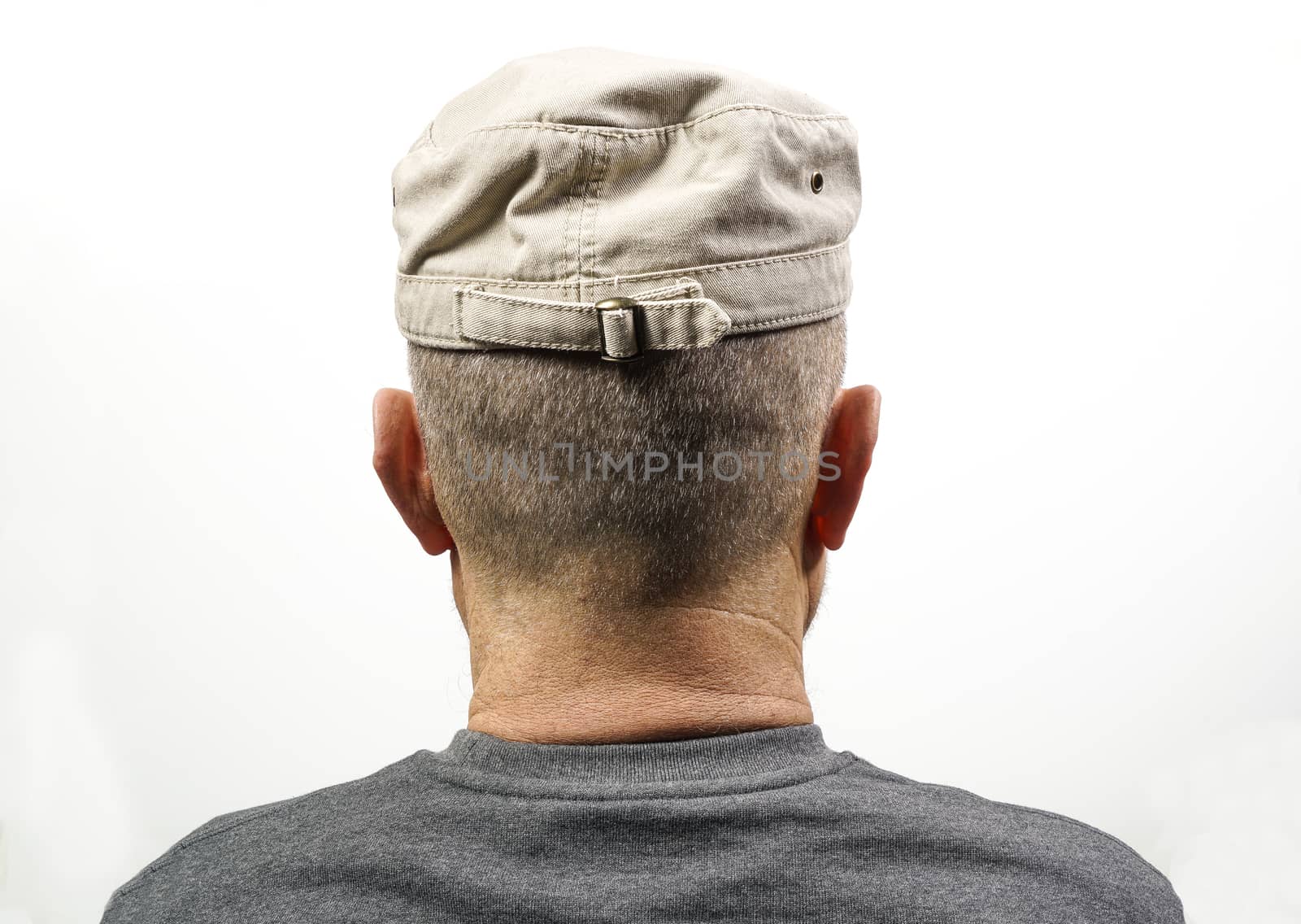 A middle-aged man turned from the back with his Hat