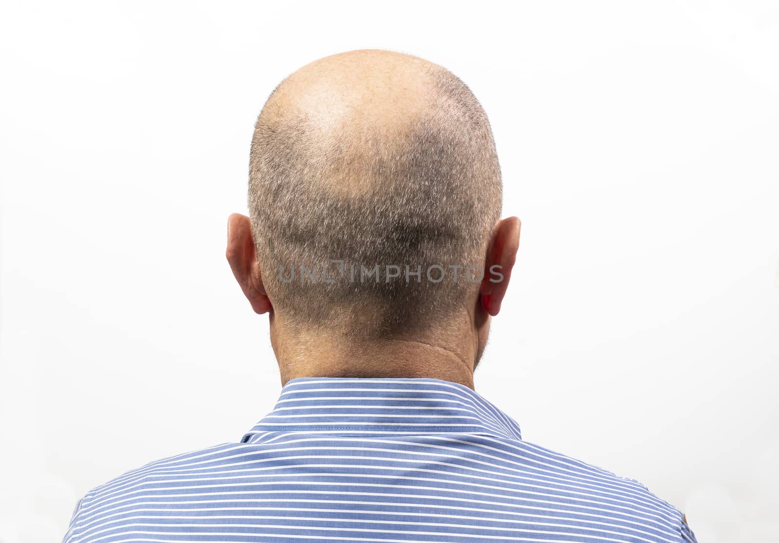 A middle-aged man turned from the back with his shirt on