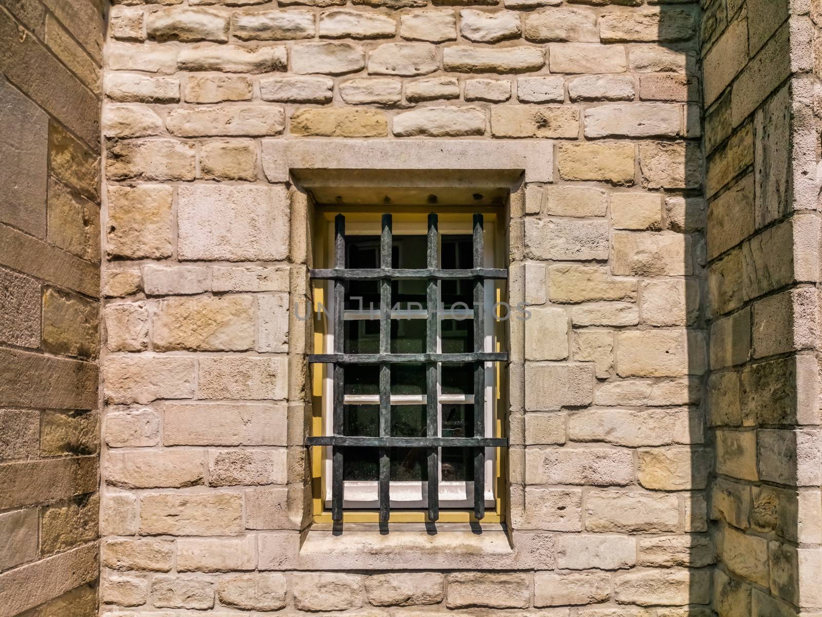 Vintage Wall with barred window, classical jail architecture, Prison background by charlottebleijenberg