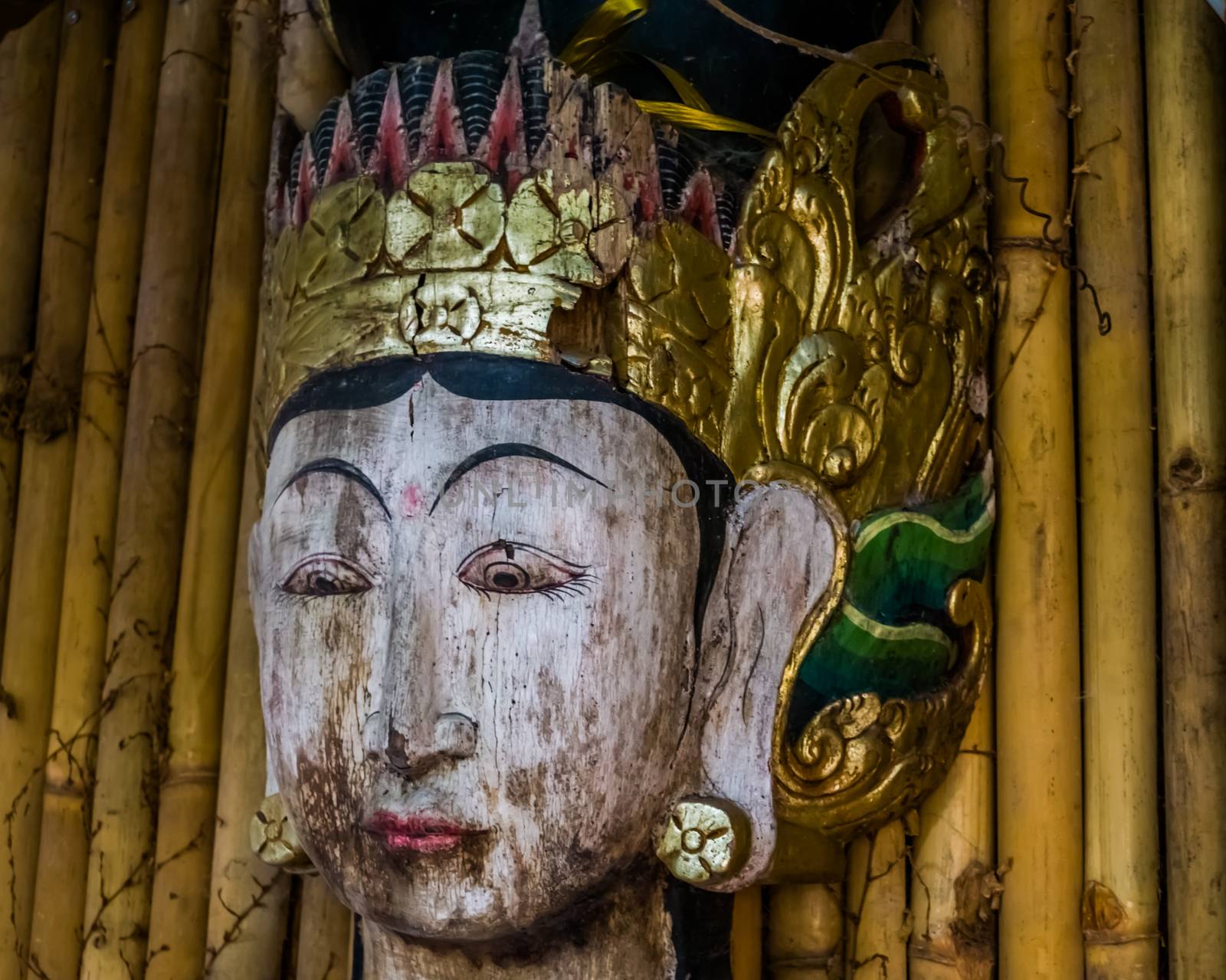 the face of a traditional asian wooden sculpture, Spiritual statue, Asian culture