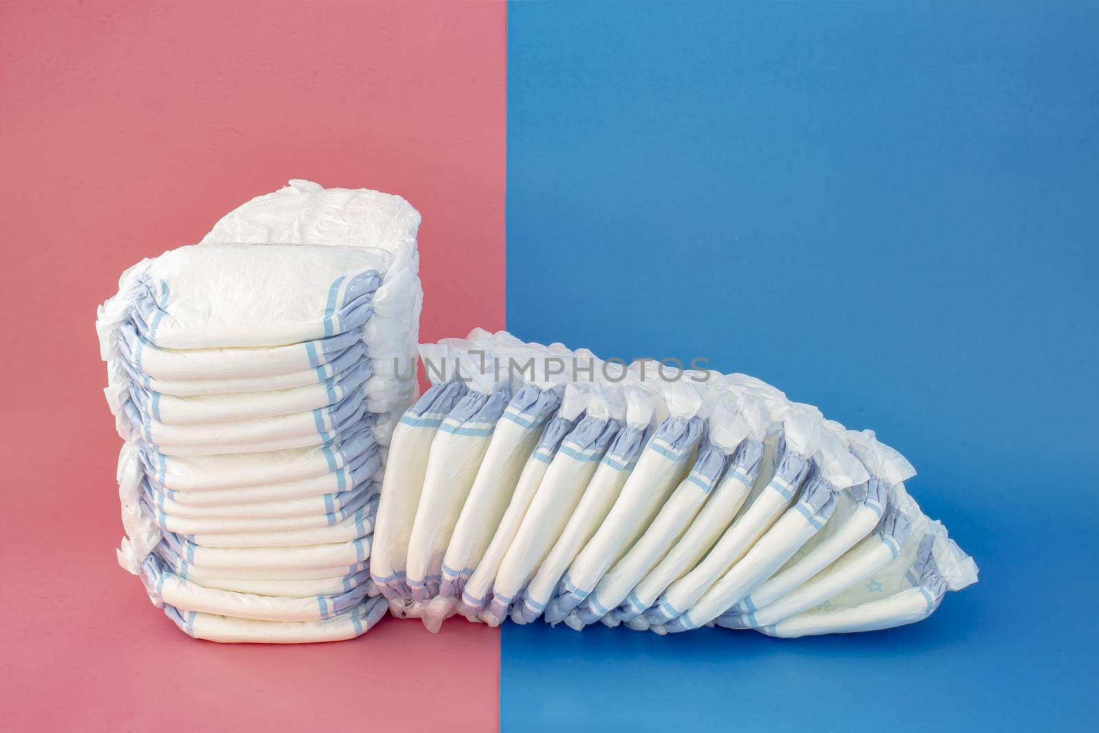 Diapers stack with some diapers falling on the right side on a blue and pink background by oasisamuel