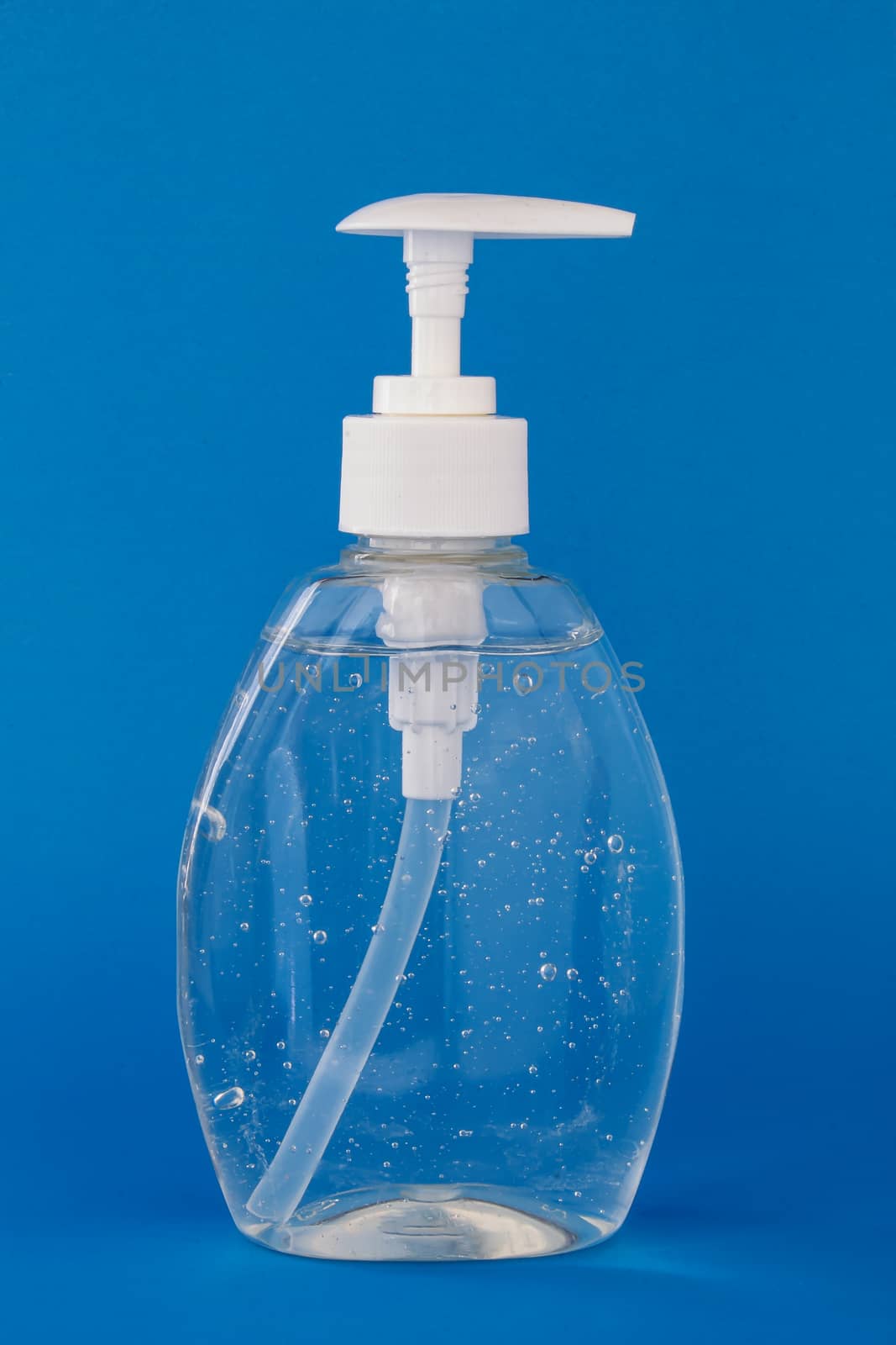 Hand sanitizer isolated on a blue background by oasisamuel