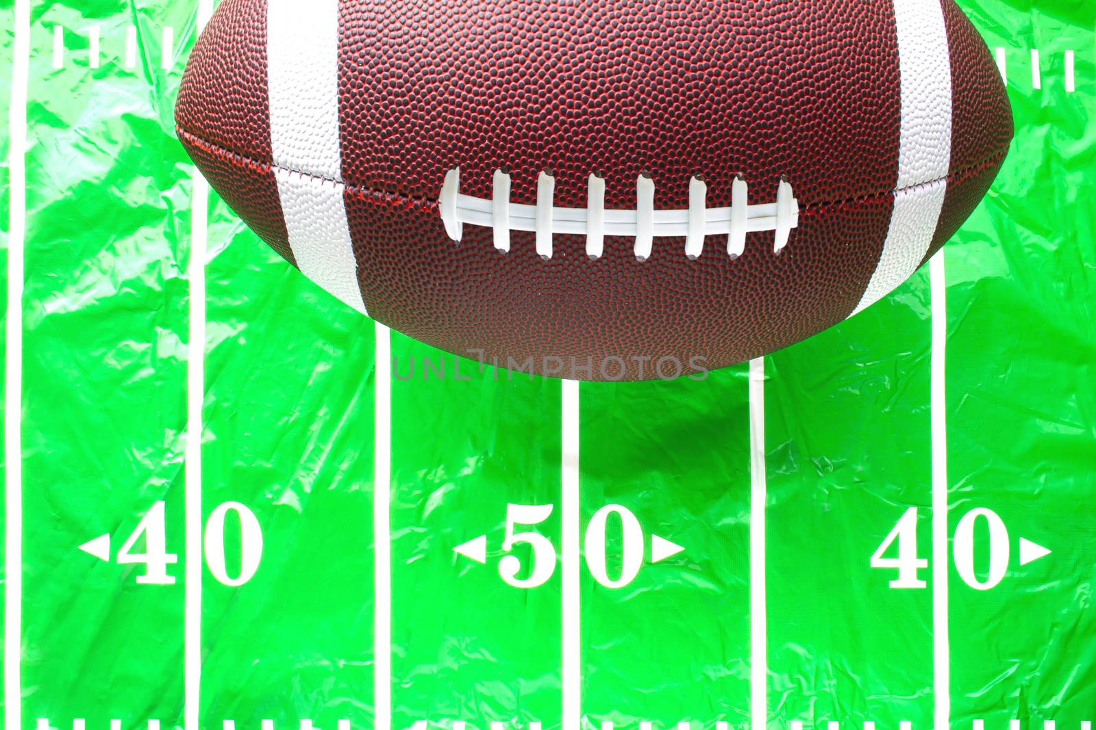 Football on a plastic fitted american football field table cover