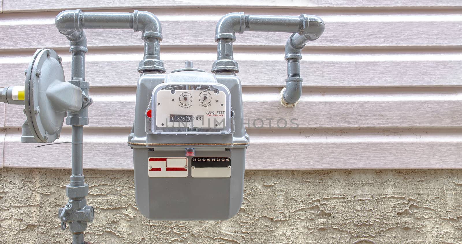 Residential urban natural gas meter measuring gas consumption, outside house gas meter by oasisamuel
