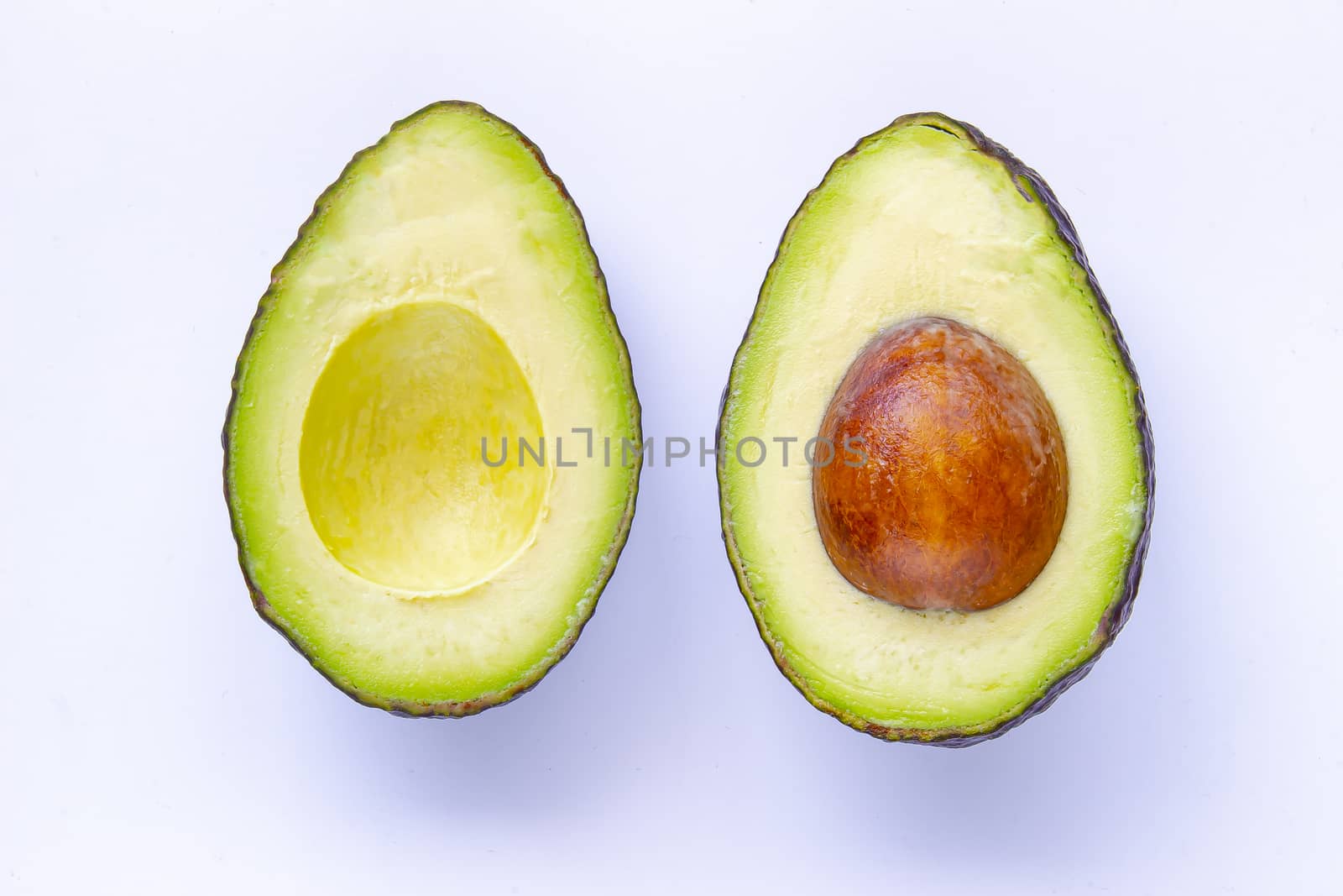 Half avocado Isolated on White Background with soft shadow