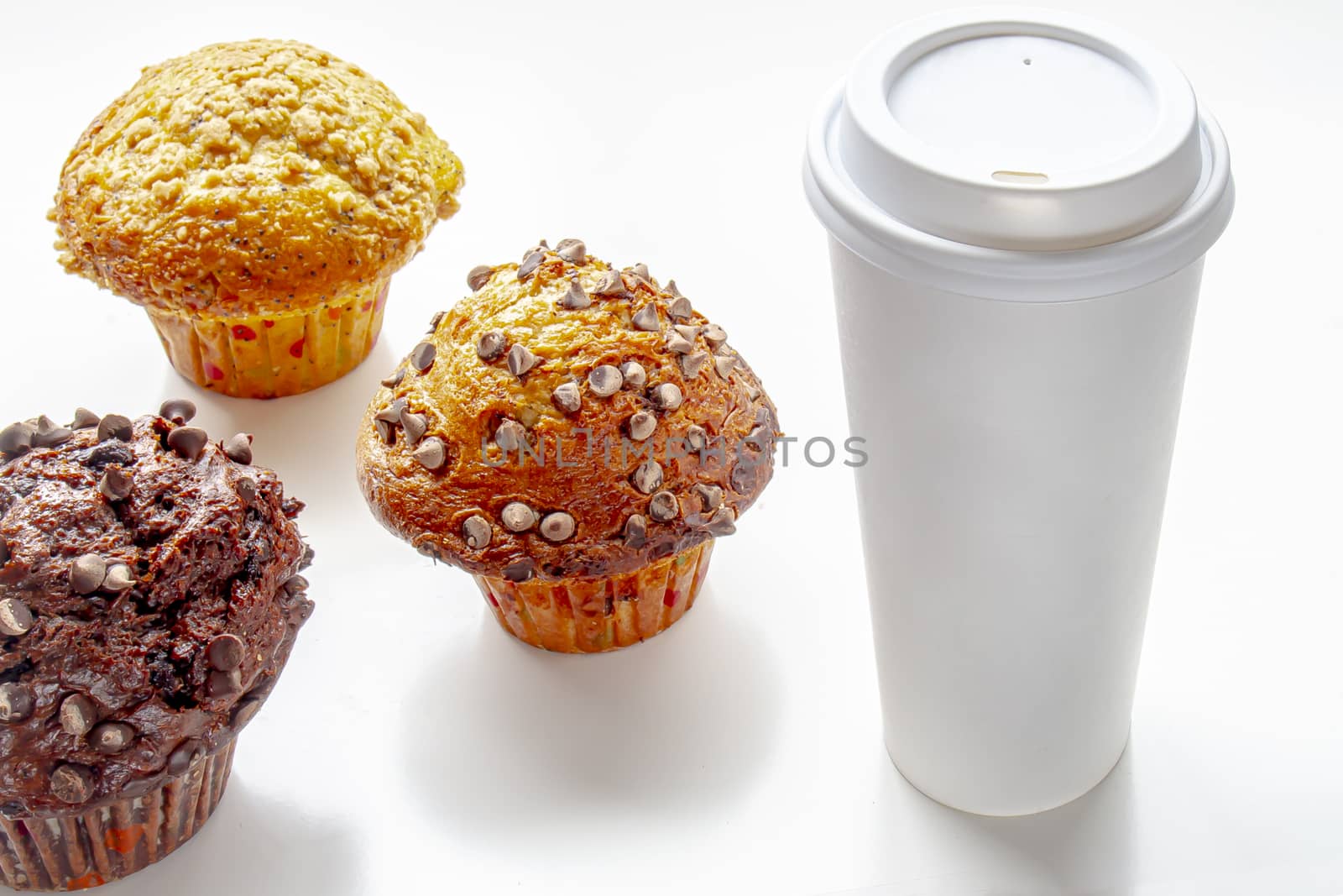 Single-use coffee Cup and muffin on white background by oasisamuel