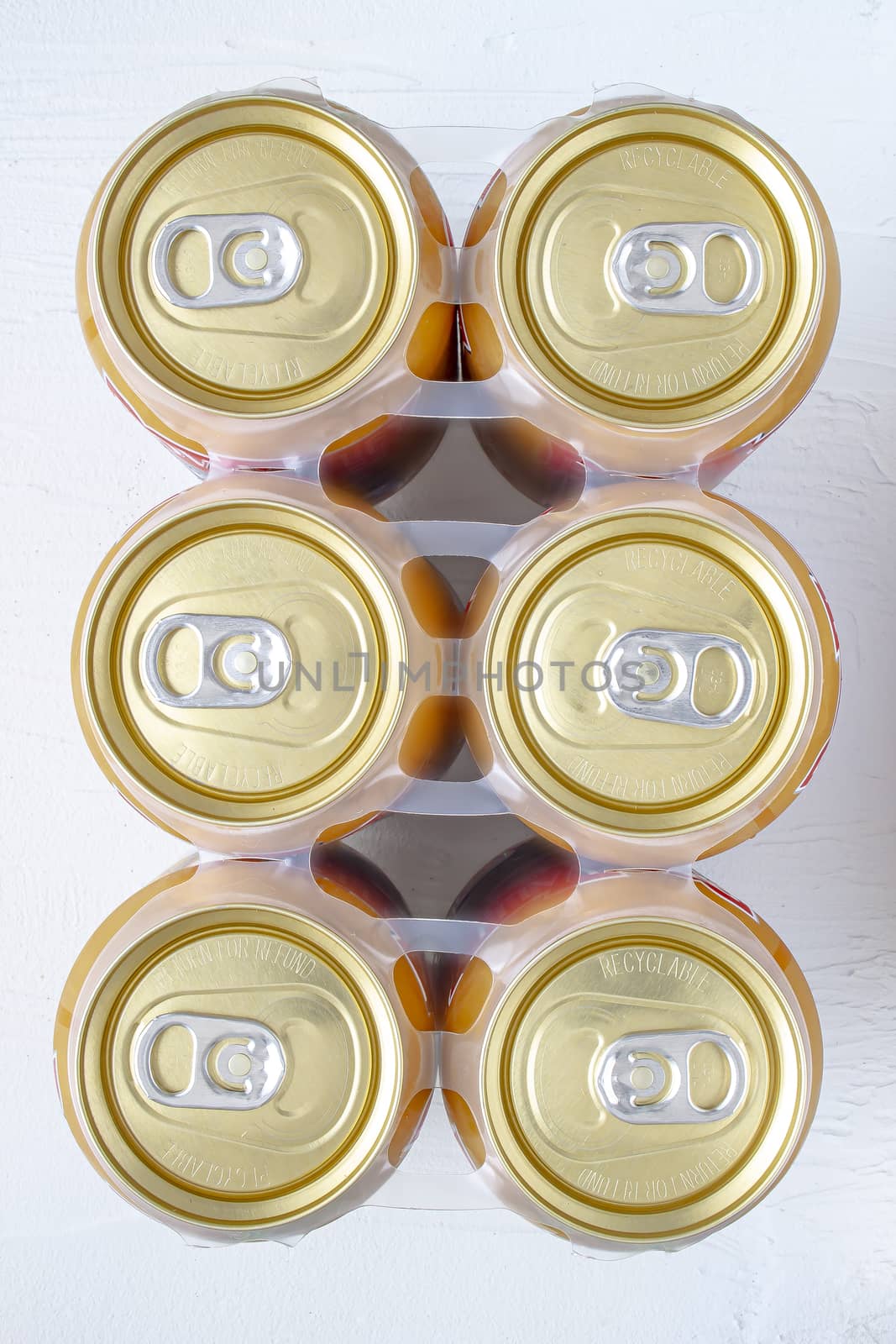 Top view of a golden can six pack of beer