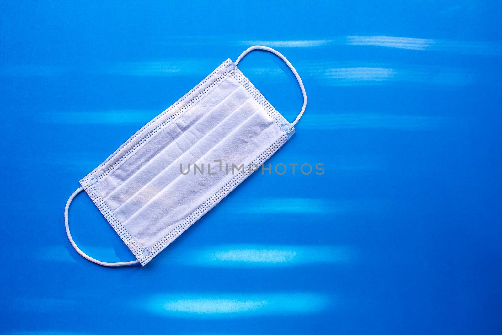 Surgical Masks, Face Mask Disposable Dust Proof Face Mask on a blue background by oasisamuel