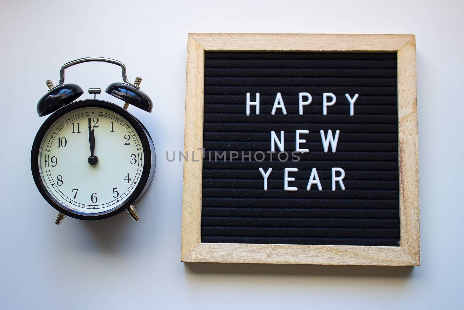 Happy New Year board with a Clock at 12 by oasisamuel