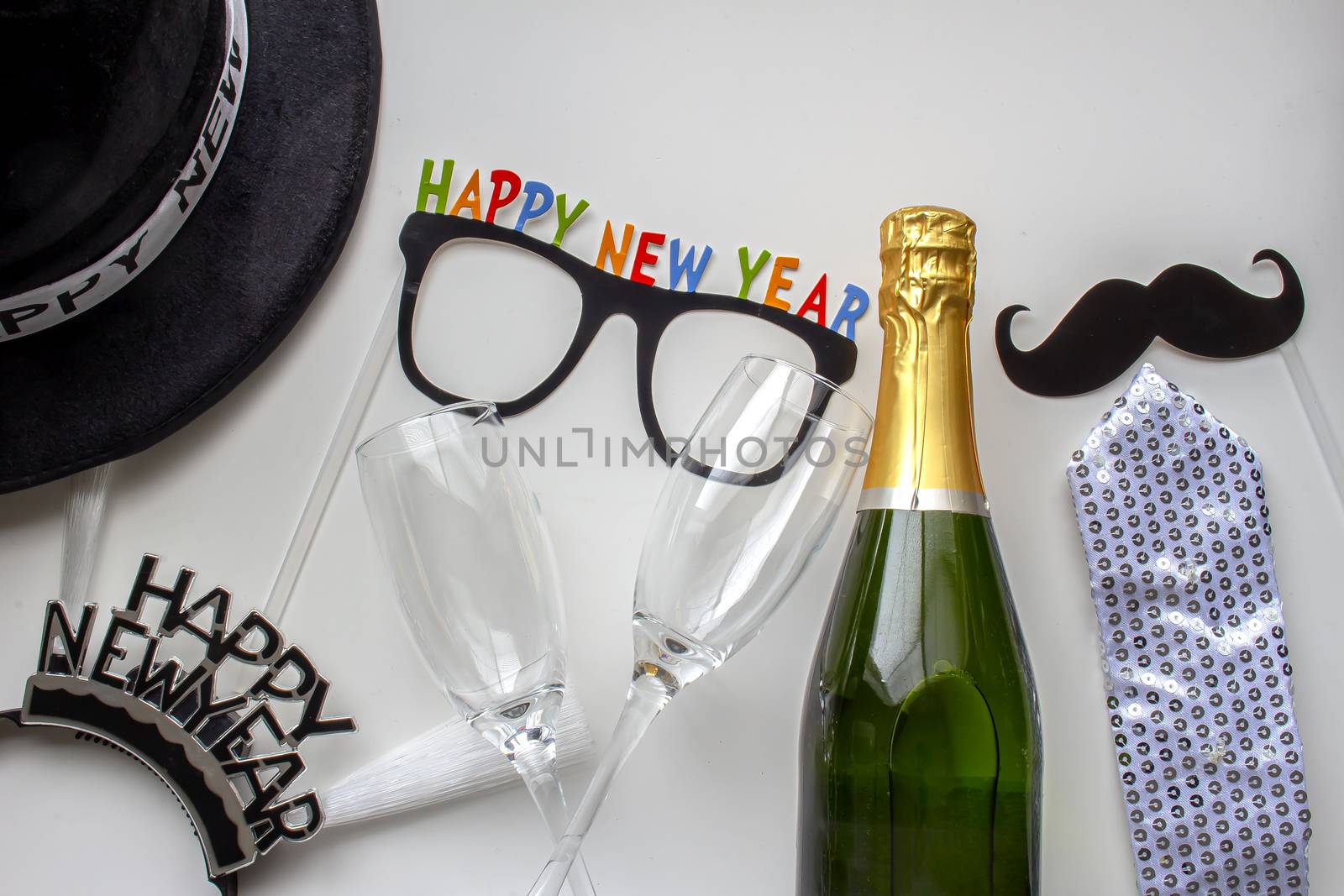 Happy New Year ornaments with champagne and cups by oasisamuel