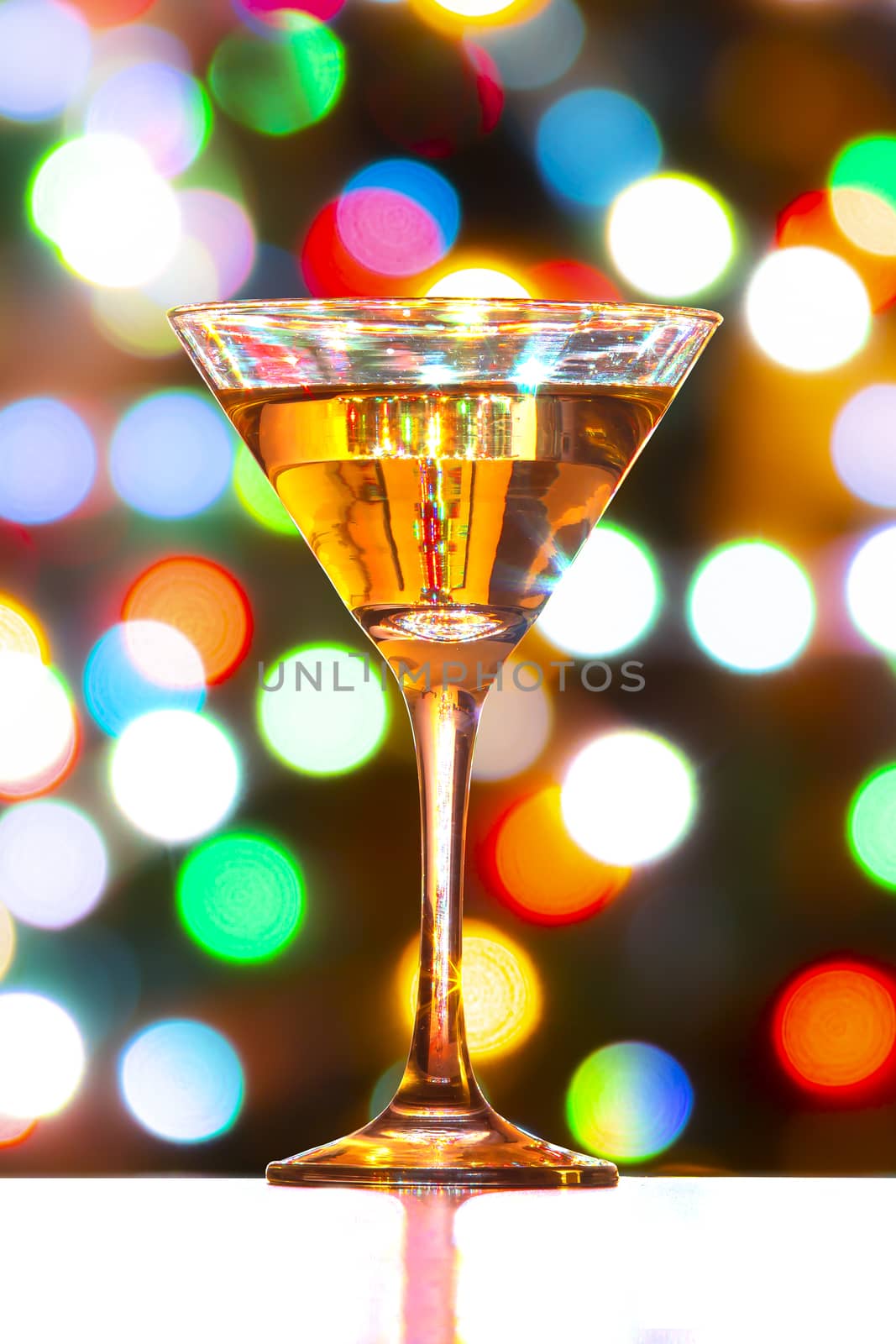 Full Martini Glass with defocused colourfull lights by oasisamuel