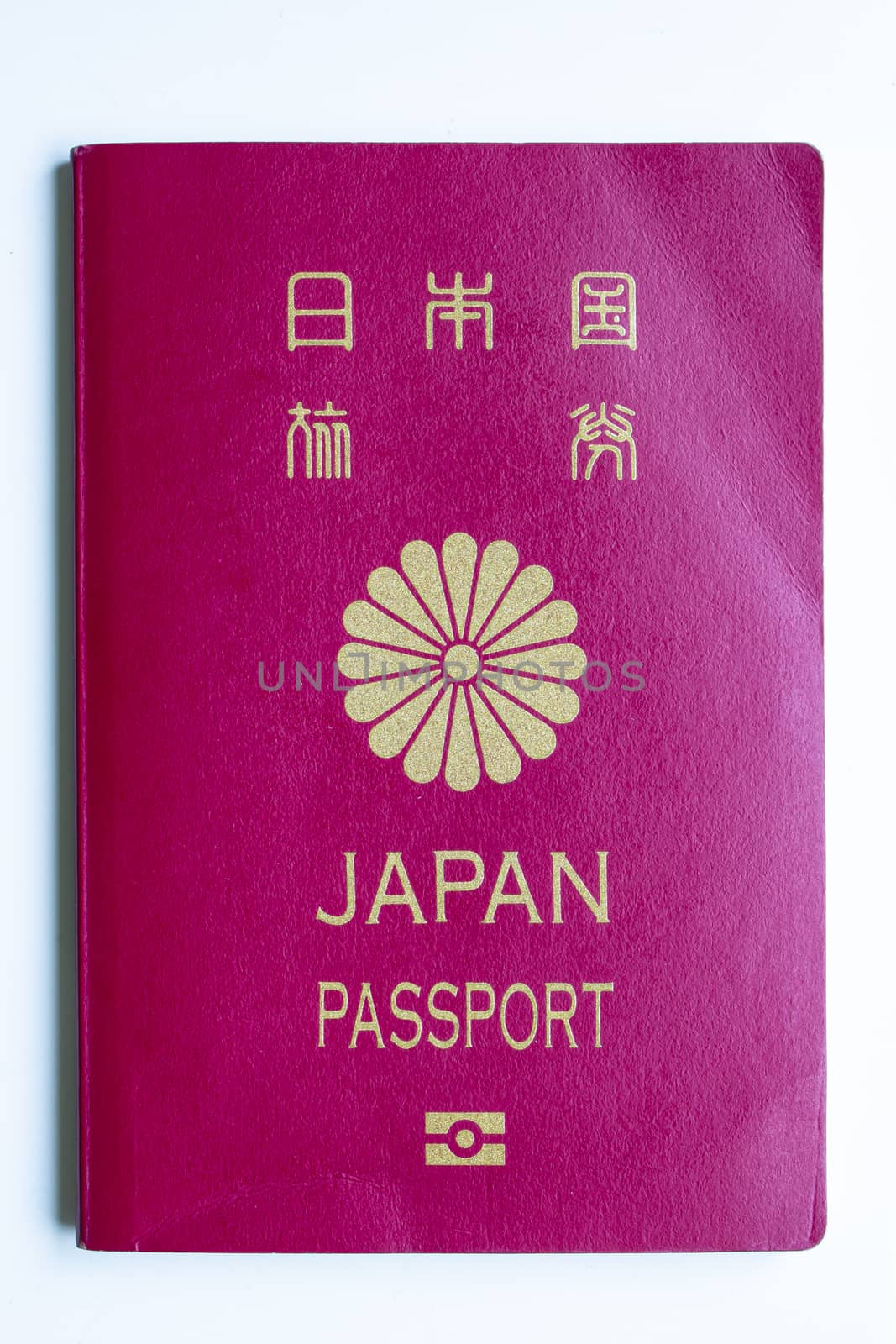Japanese passport front cover on a white background