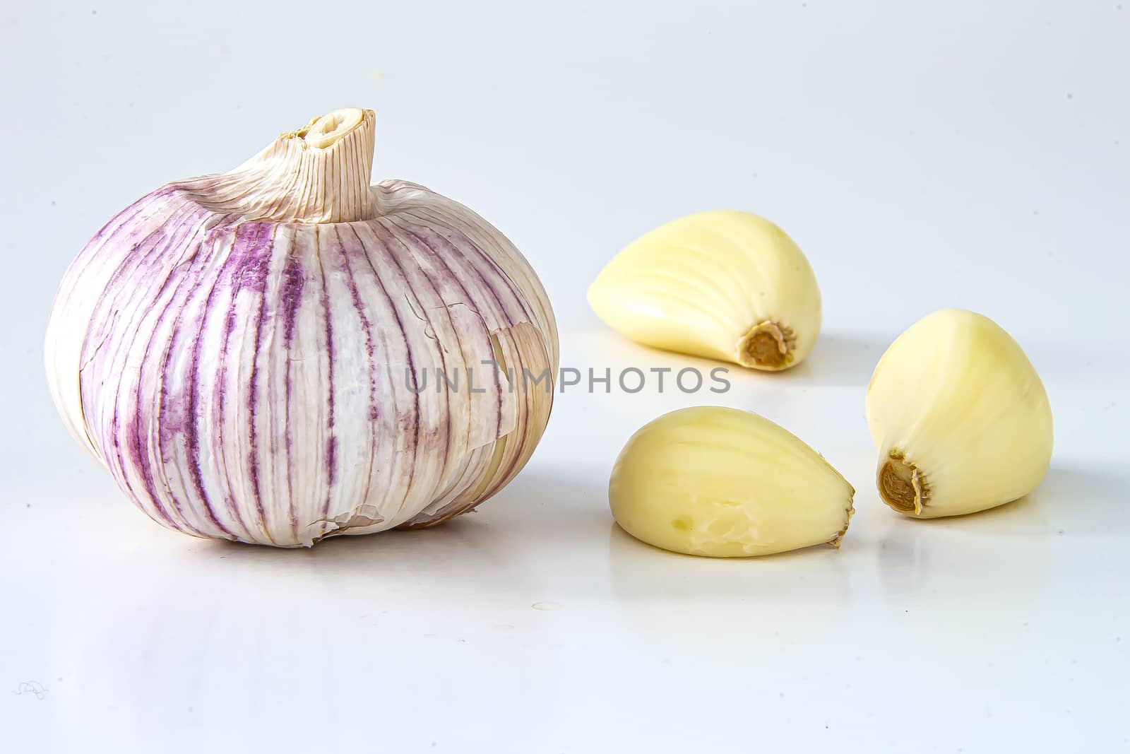 Isolated Fresh garlic. Raw garlics on a white background by oasisamuel
