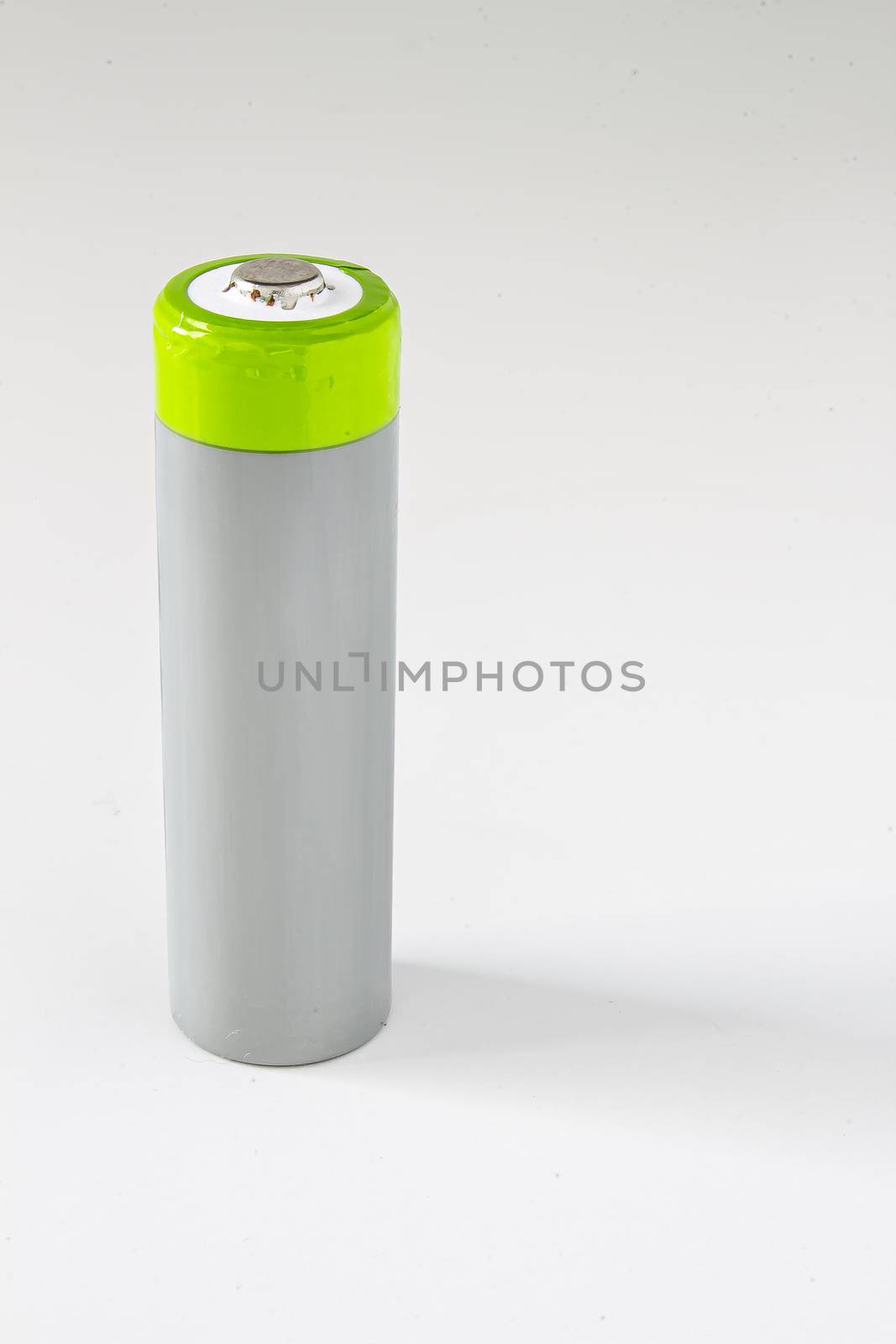 A single High-Capacity Rechargeable Battery with a shadow on a white background by oasisamuel