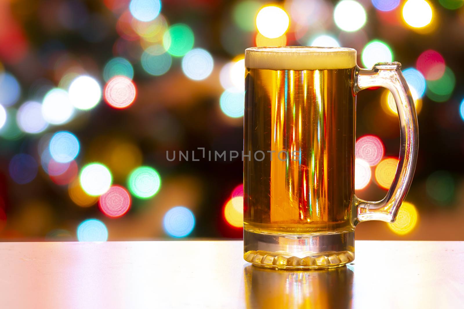 A Beer jug with Christmas lights on the background