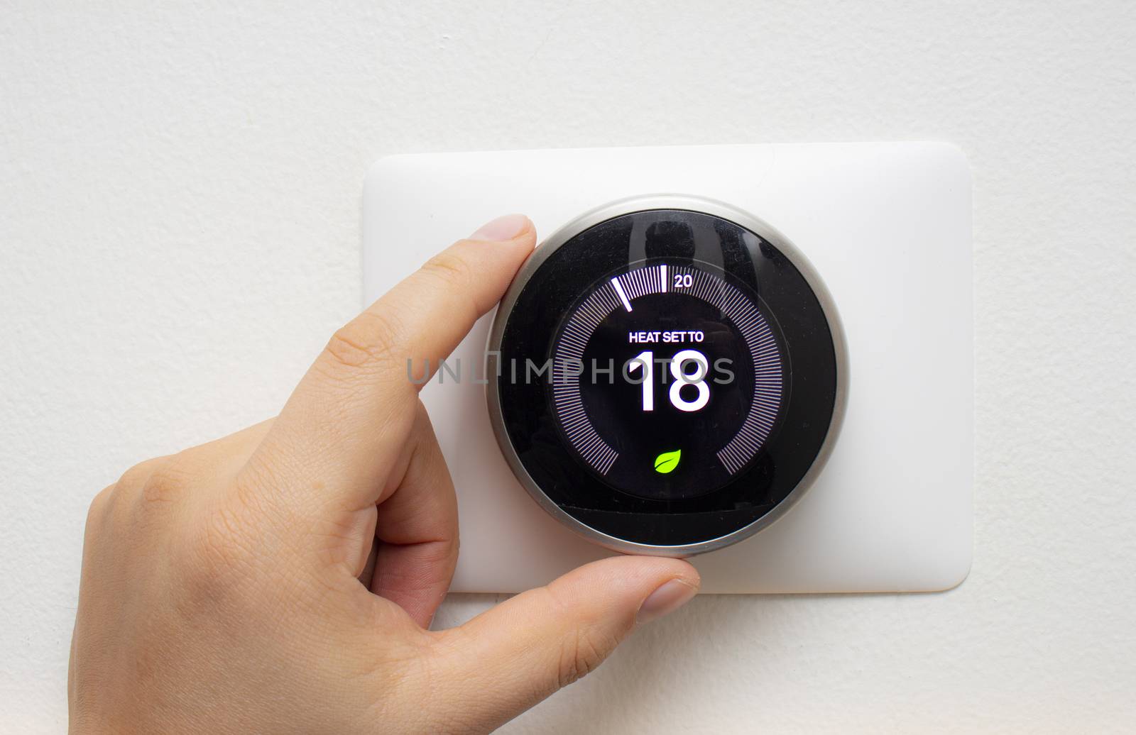 Smart Thermostat with a person saving energy with a soft shadow by oasisamuel