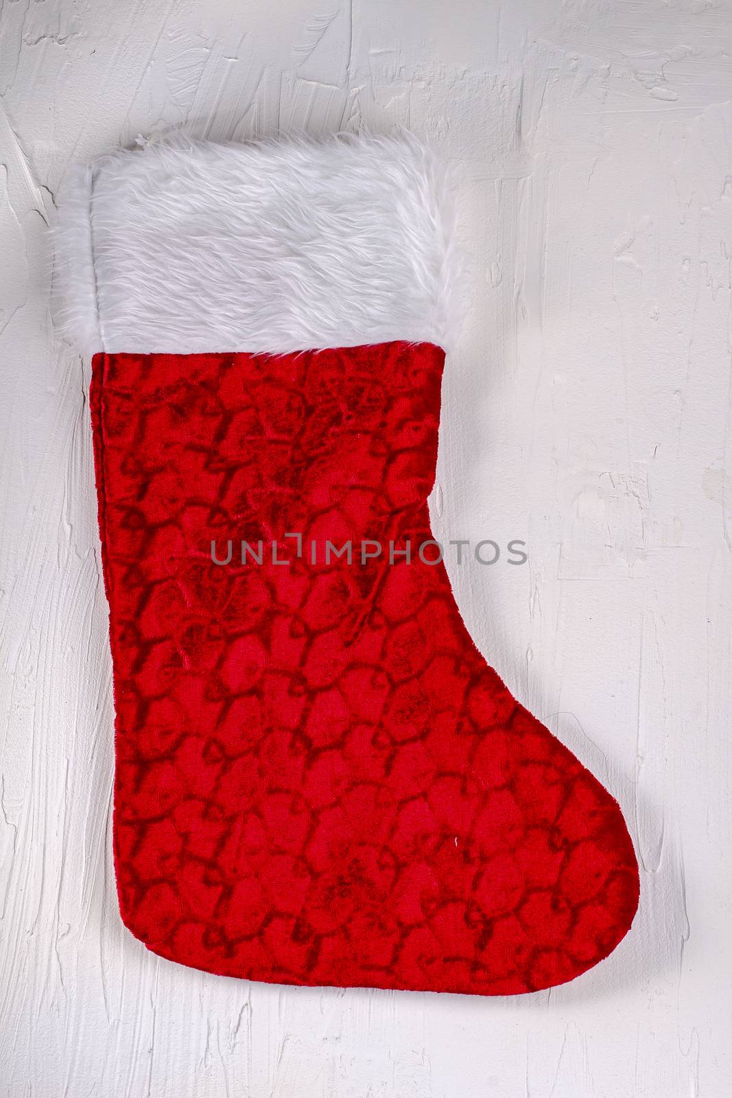 Christmas stocking on texture white background