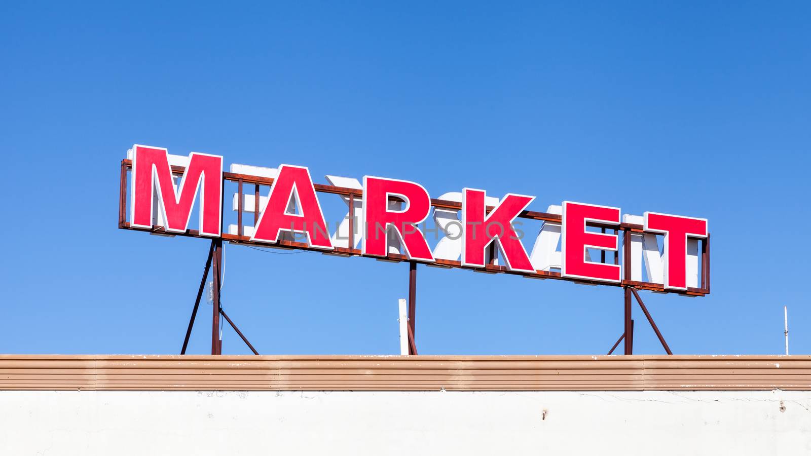 A signpost highlights the location of a local market in southern Turkey.