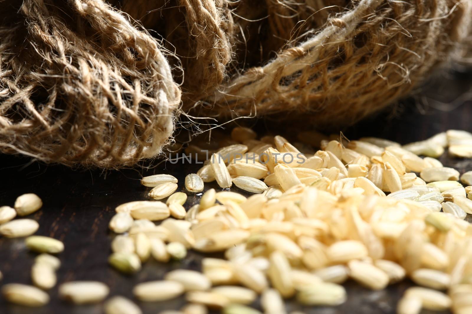 rice corn with on wooden table with cotton bag showing