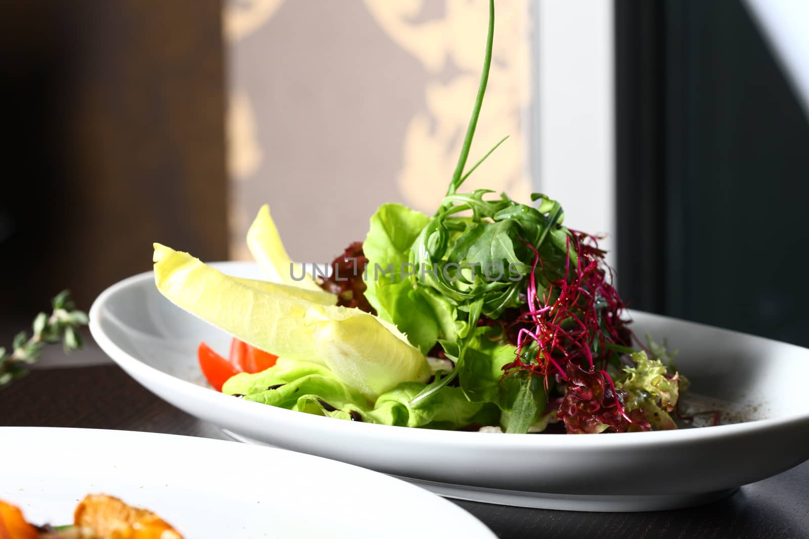 a good meal with a salad on a restaurant setting