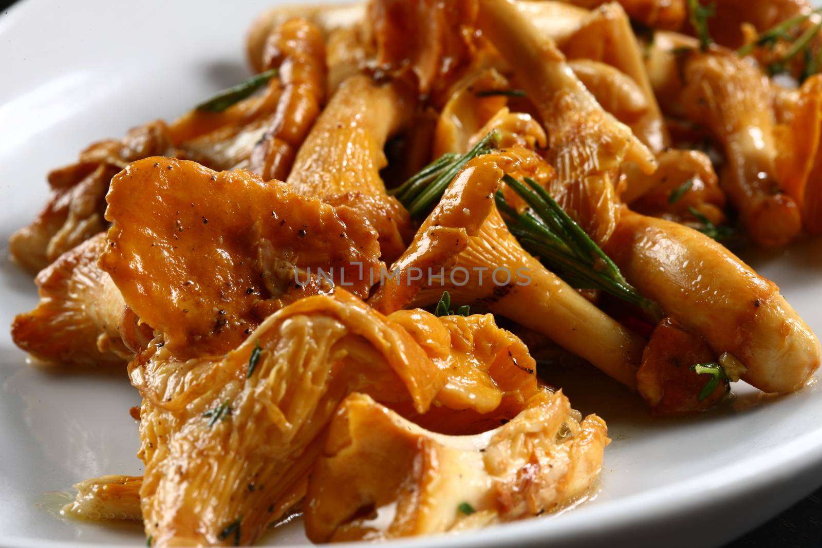 Close up of mushrooms on table top, ready to served for guests in a white plate
