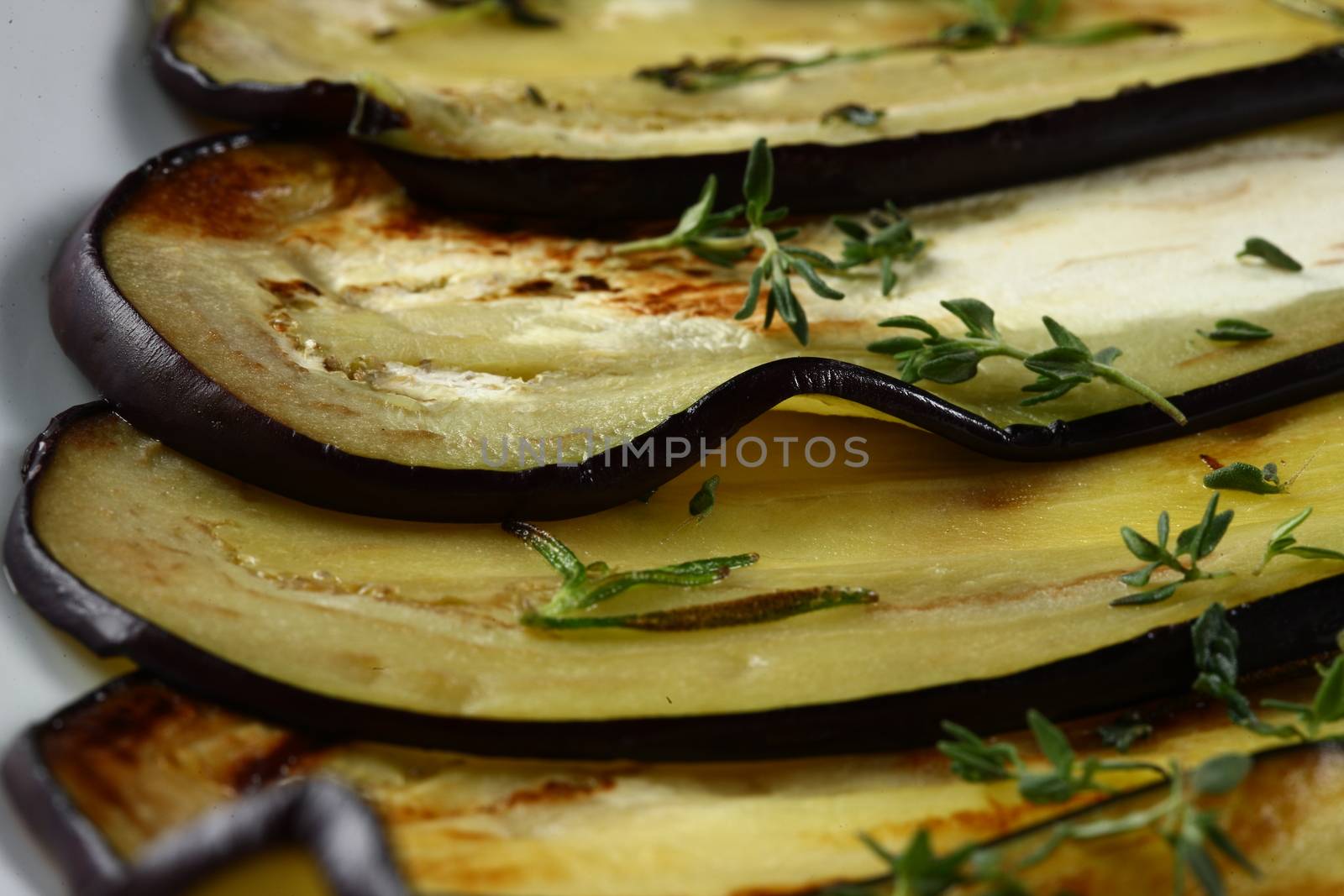Close up of cooked leek on food plates on table top, ready to served for guests in a light setting